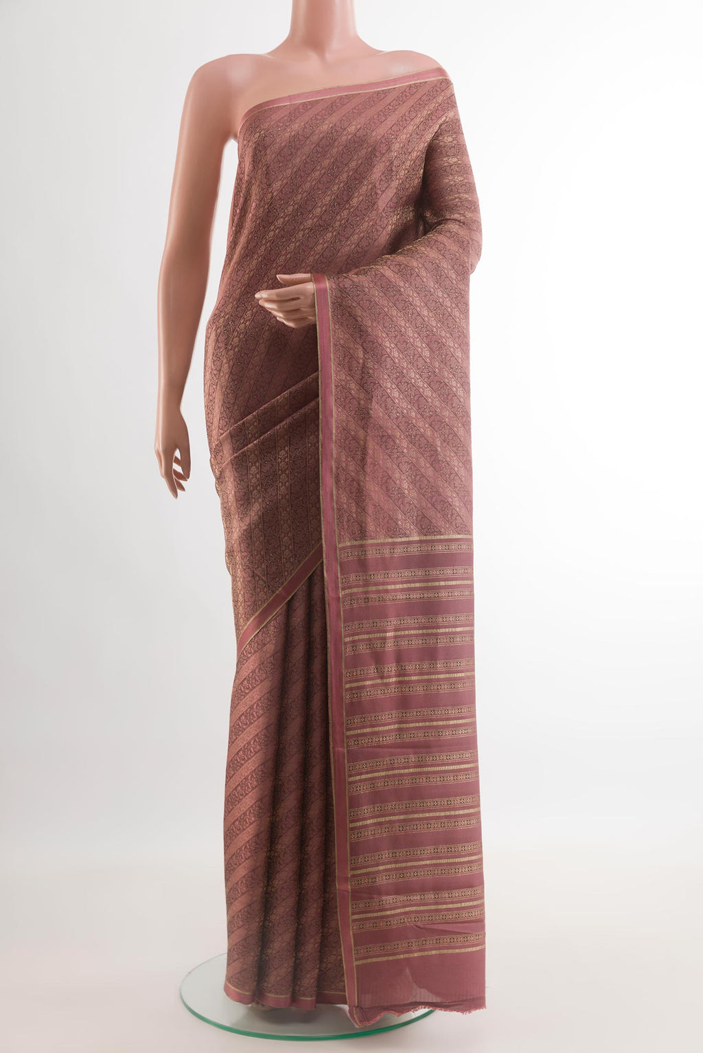 Mauve Mysore Crepe Saree with Zari Brocade on the body and Zari Border.  displayed on a mannequin