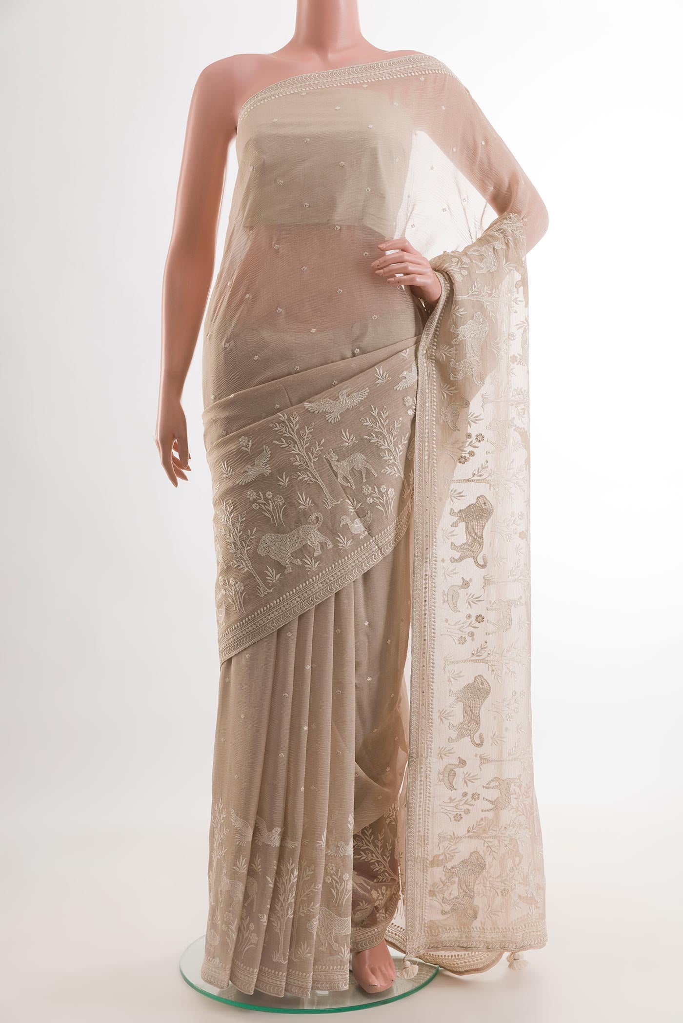 Beige Mysore Georgette Saree with Embroidery on the body and Embroidery Border.  displayed on a mannequin