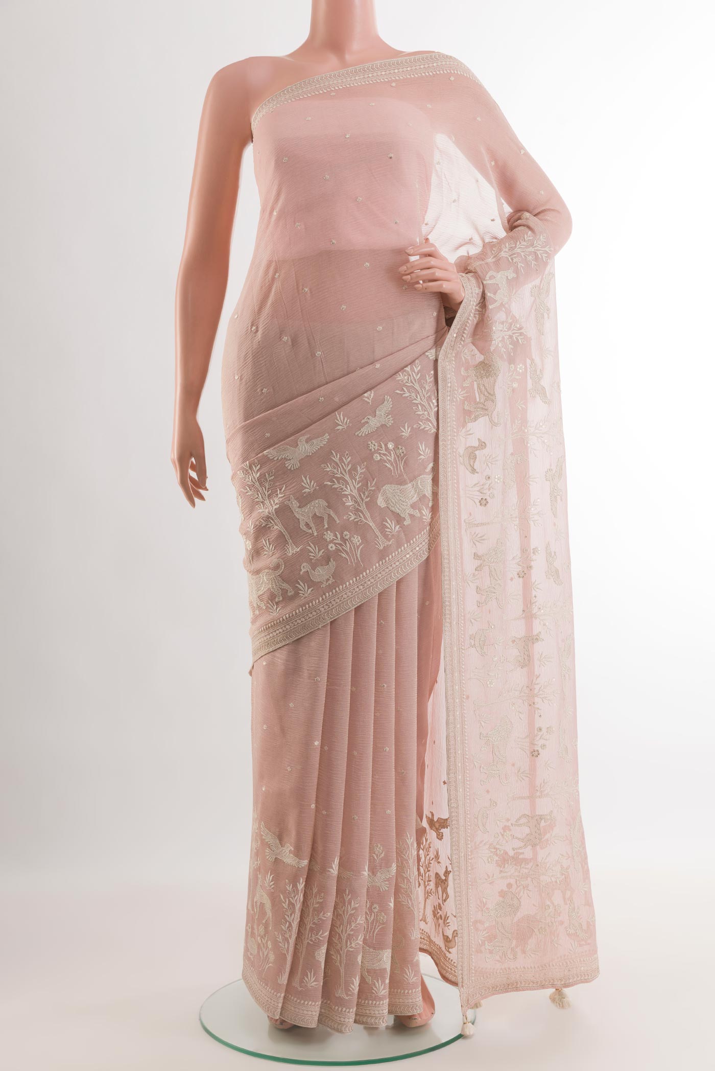 Rose Gold Mysore Chiffon Saree with Embroidery on the body and Zari Border.  displayed on a mannequin