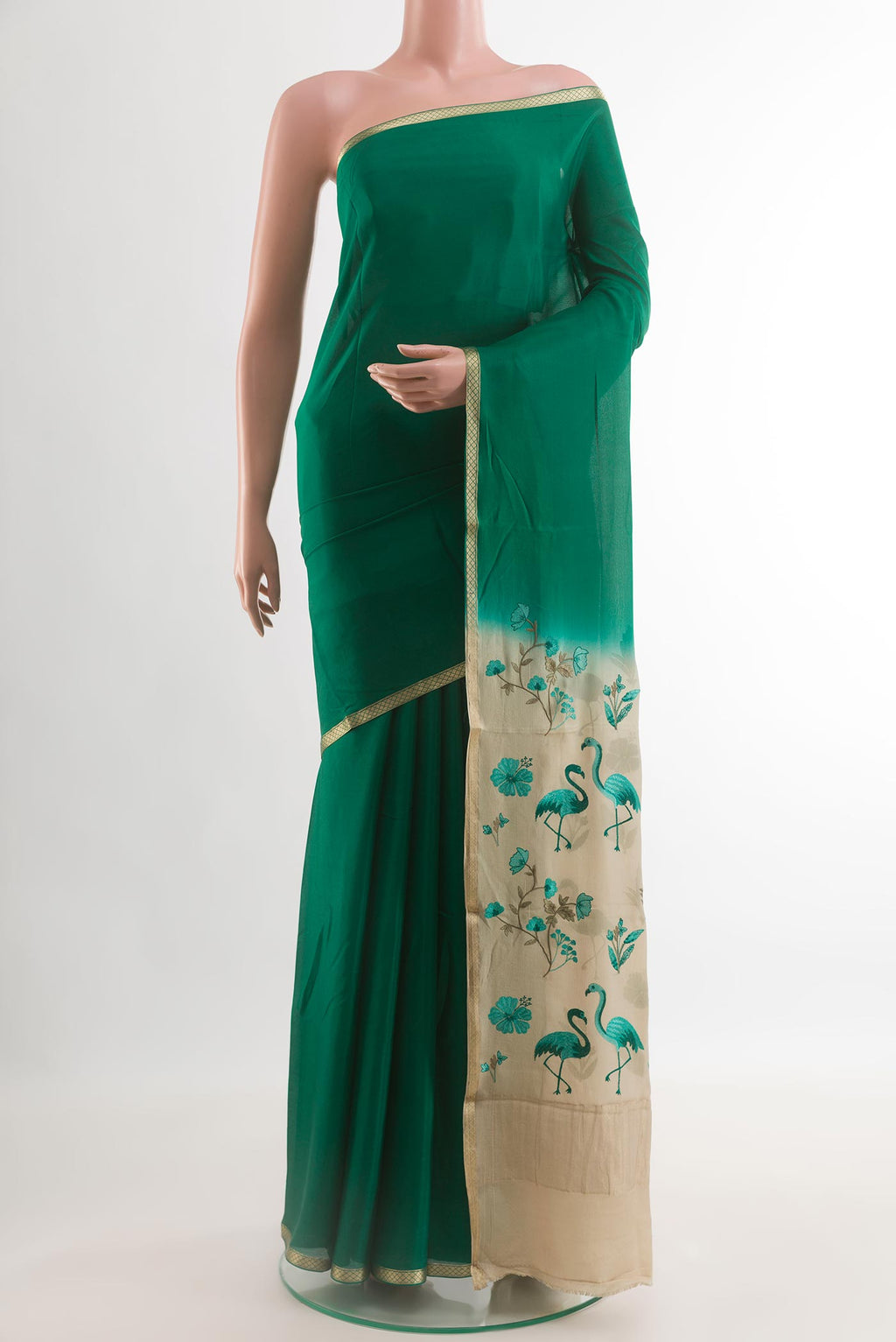 Green Mysore Crepe Saree with Plain Body and Zari Border.  displayed on a mannequin