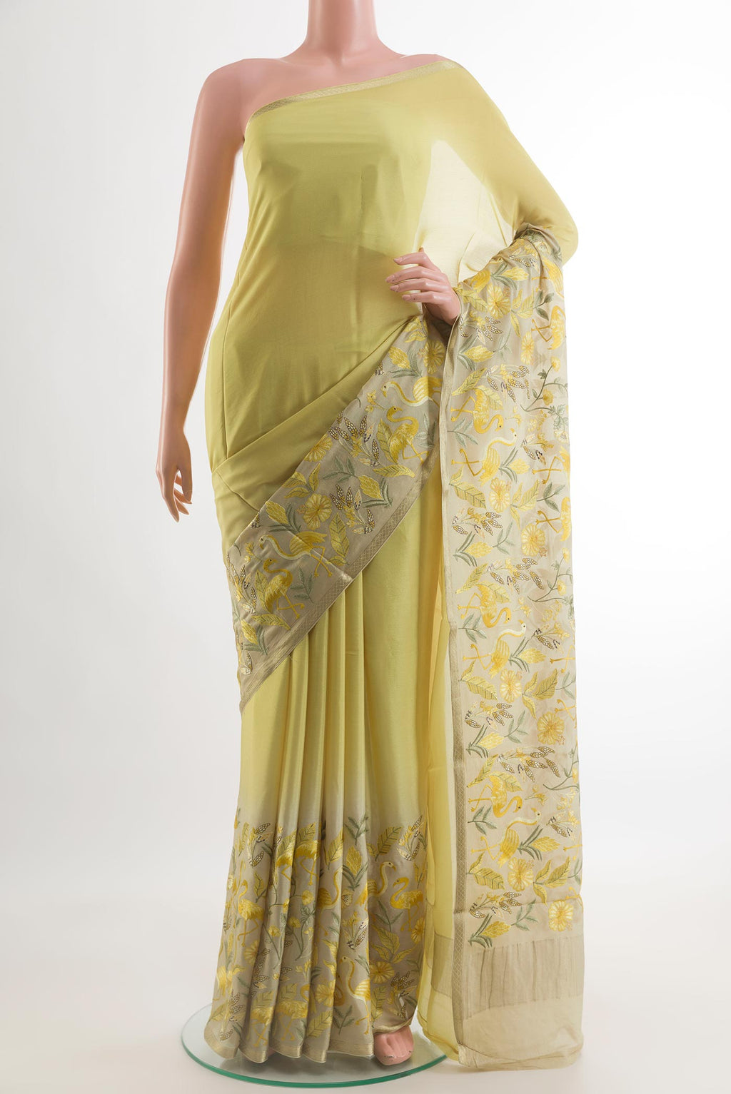 Lemon Yellow Mysore Crepe Saree with Plain Body and Zari Border.  displayed on a mannequin