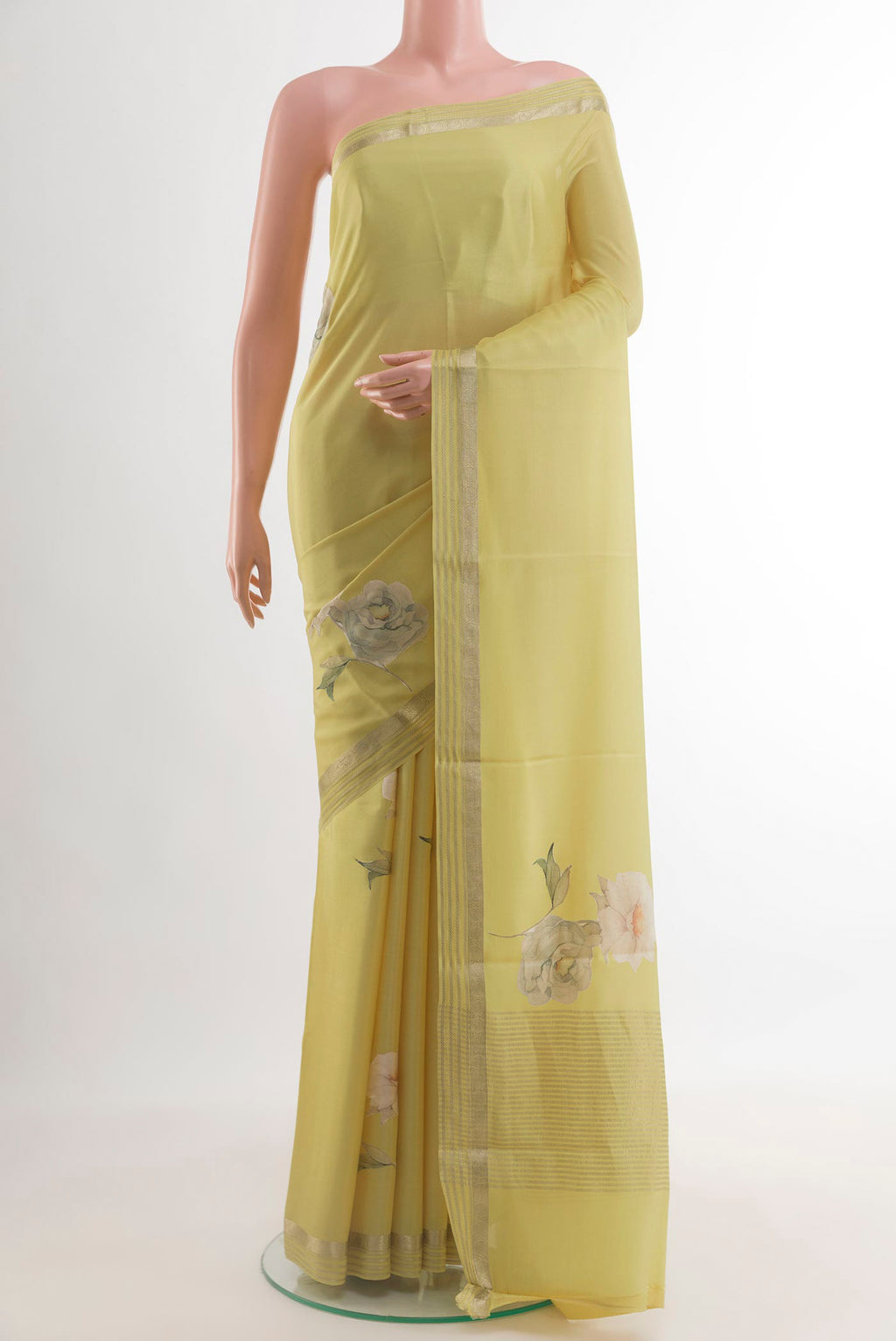 Lemon Yellow Mysore Crepe Saree with Floral Print on the body and Zari Border.  displayed on a mannequin