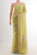 Lemon Yellow Mysore Crepe Saree with Floral Print on the body and Zari Border.  displayed on a mannequin