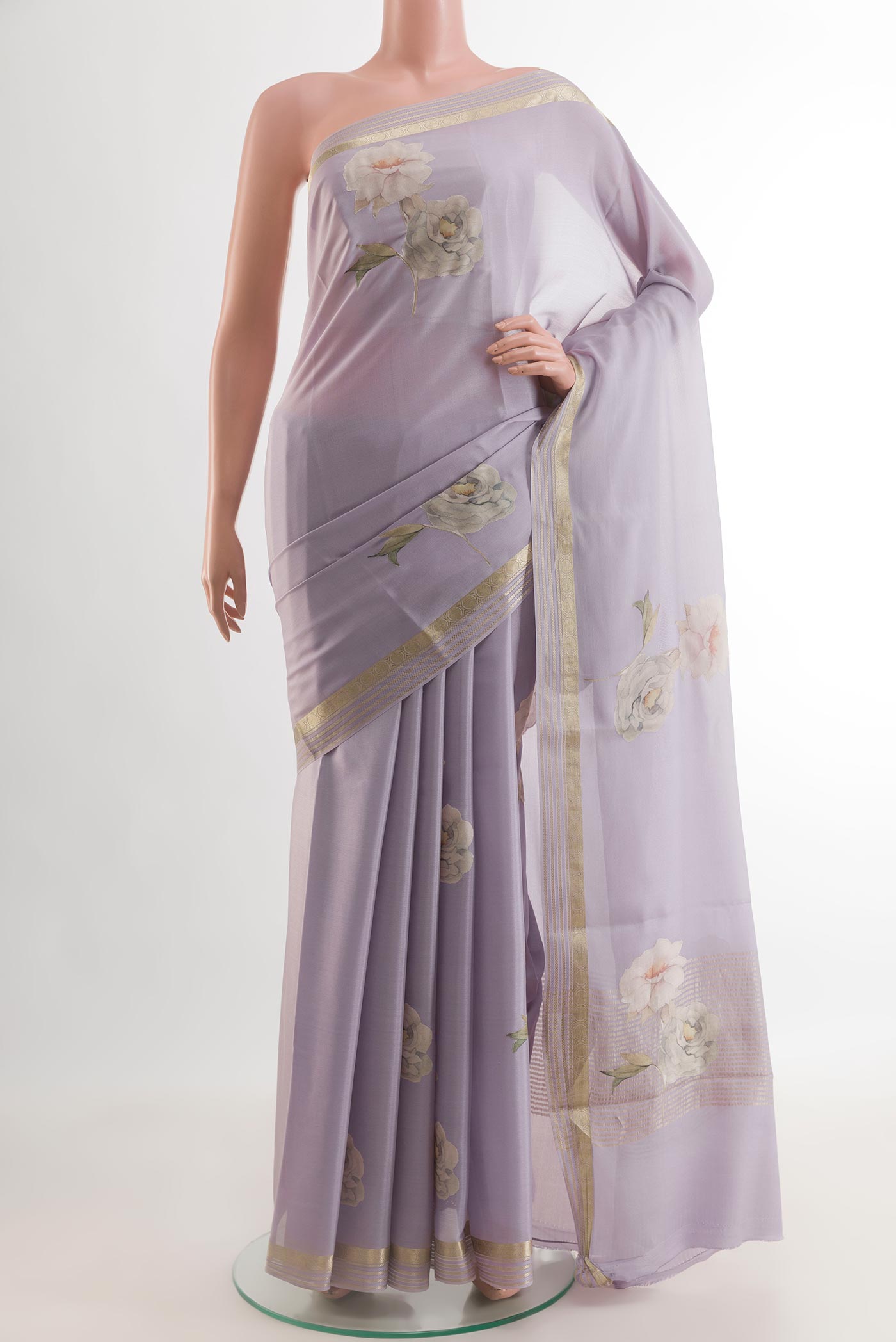 Lavender Mysore Crepe Saree with Floral Print on the body and Zari Border.  displayed on a mannequin