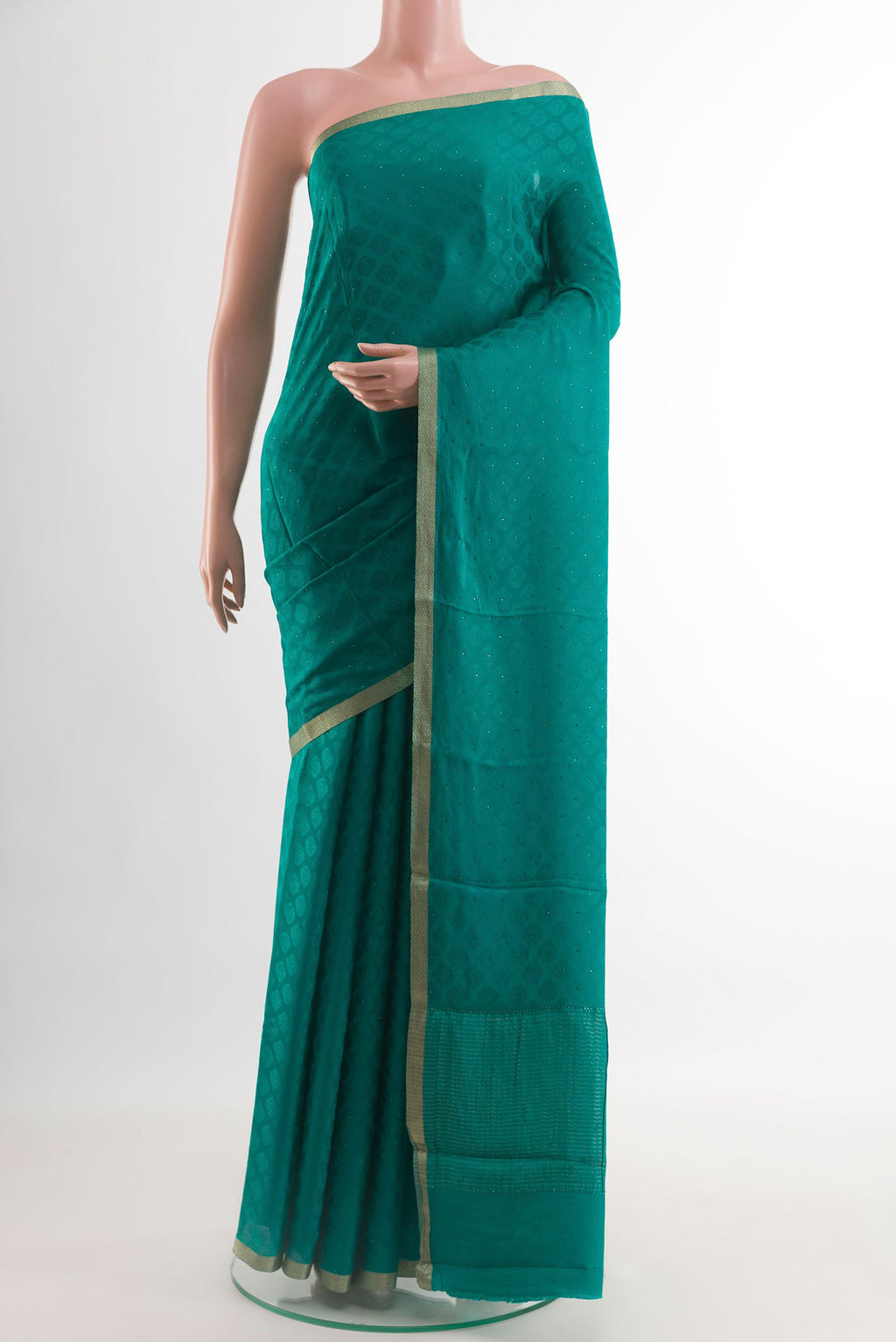 Sea Green Mysore Crepe Saree with Jacquard design on the body and Zari Border.  displayed on a mannequin