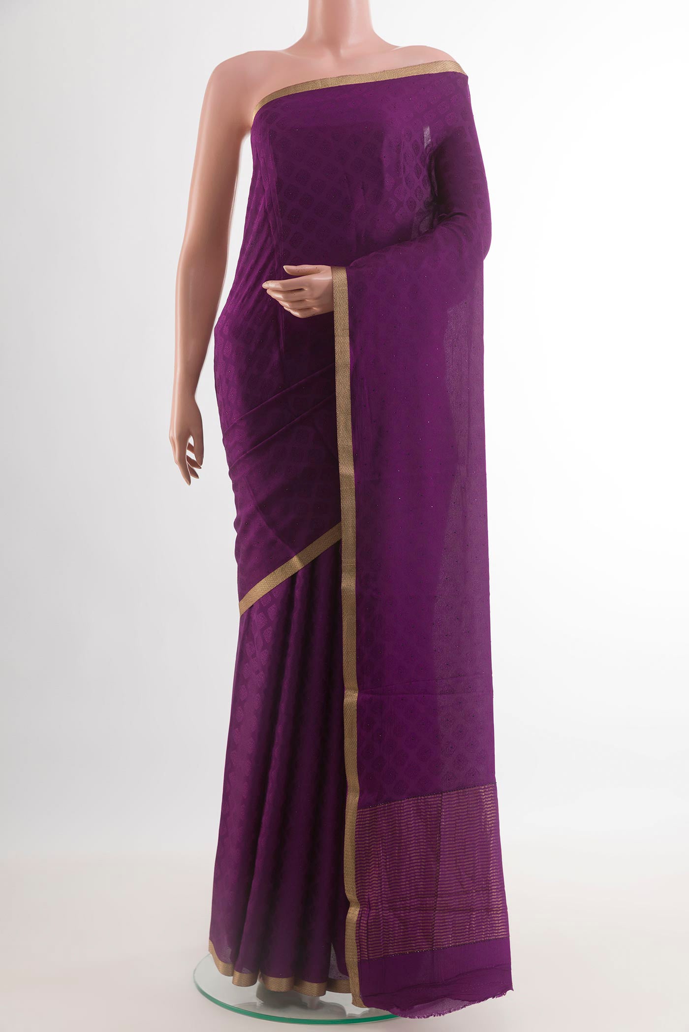 Purple Mysore Crepe Saree with Jacquard design on the body and Zari Border.  displayed on a mannequin