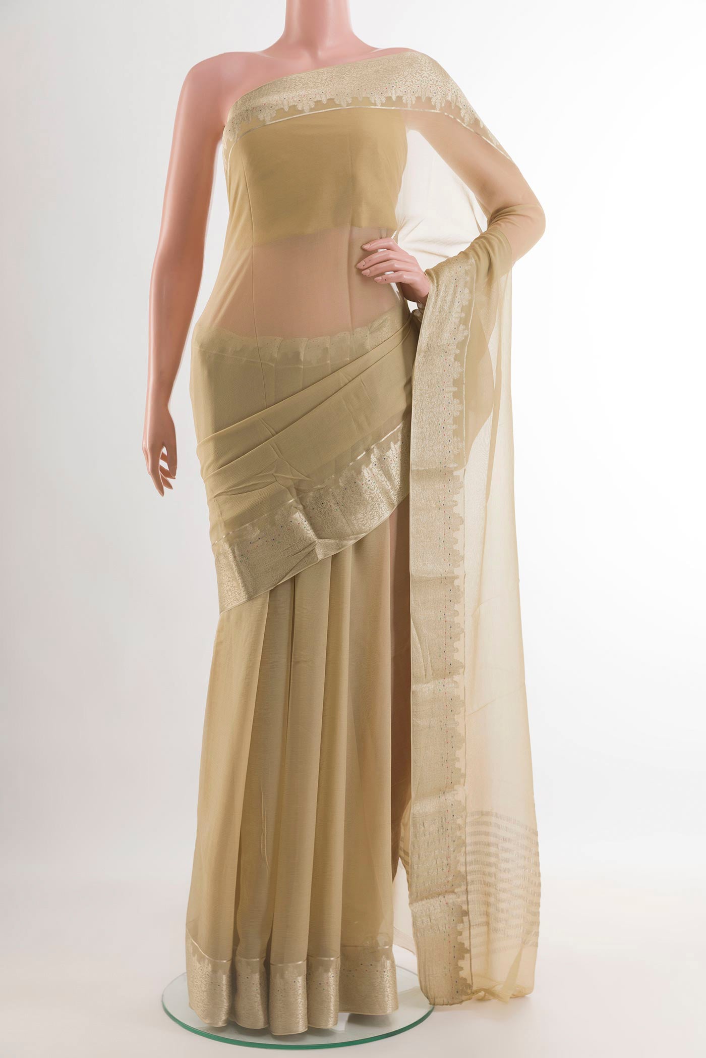 Beige Mysore Chiffon Saree with Plain Body and Zari Border.  displayed on a mannequin