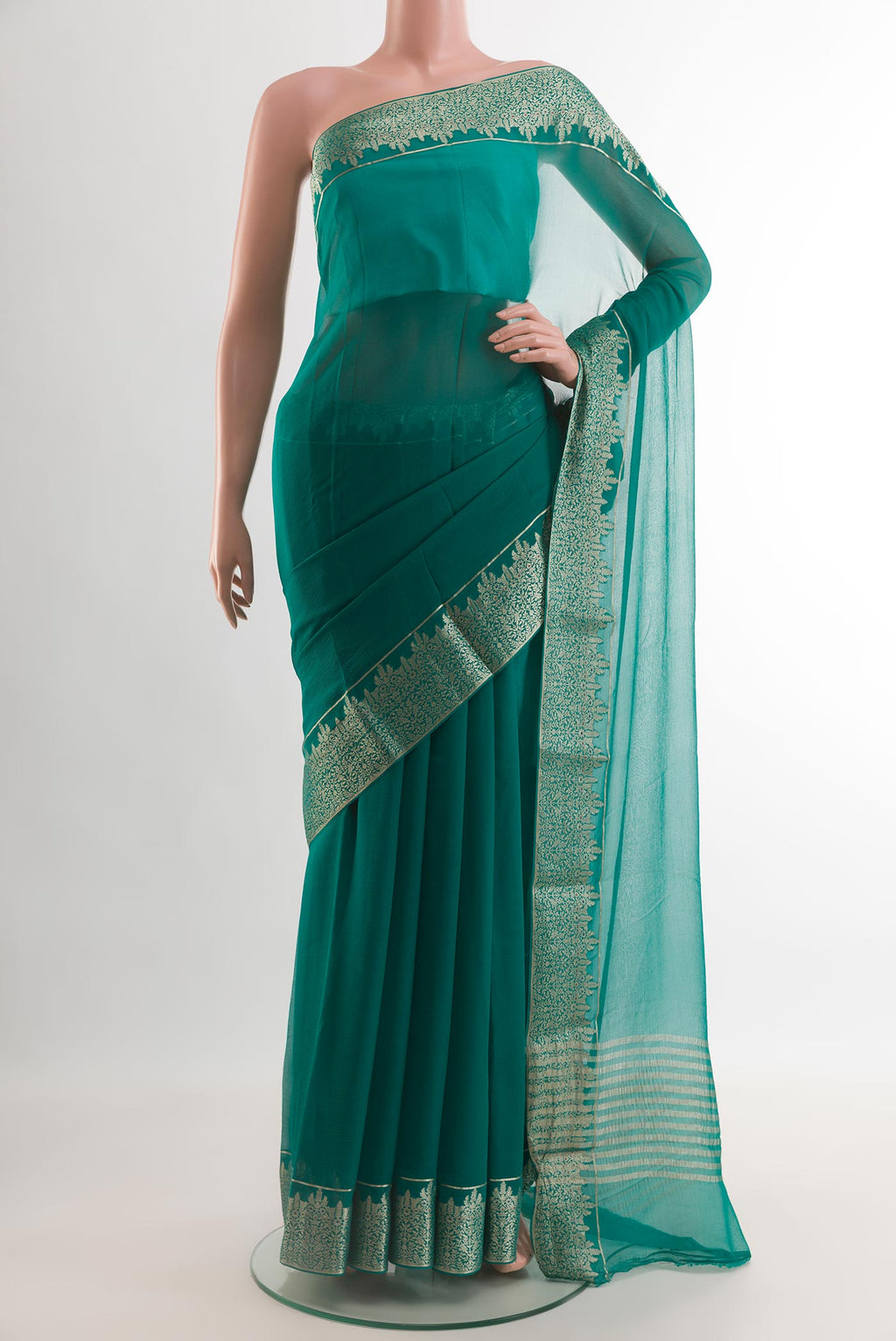 Sea Green Mysore Chiffon Saree with Plain Body and Zari Border.  displayed on a mannequin