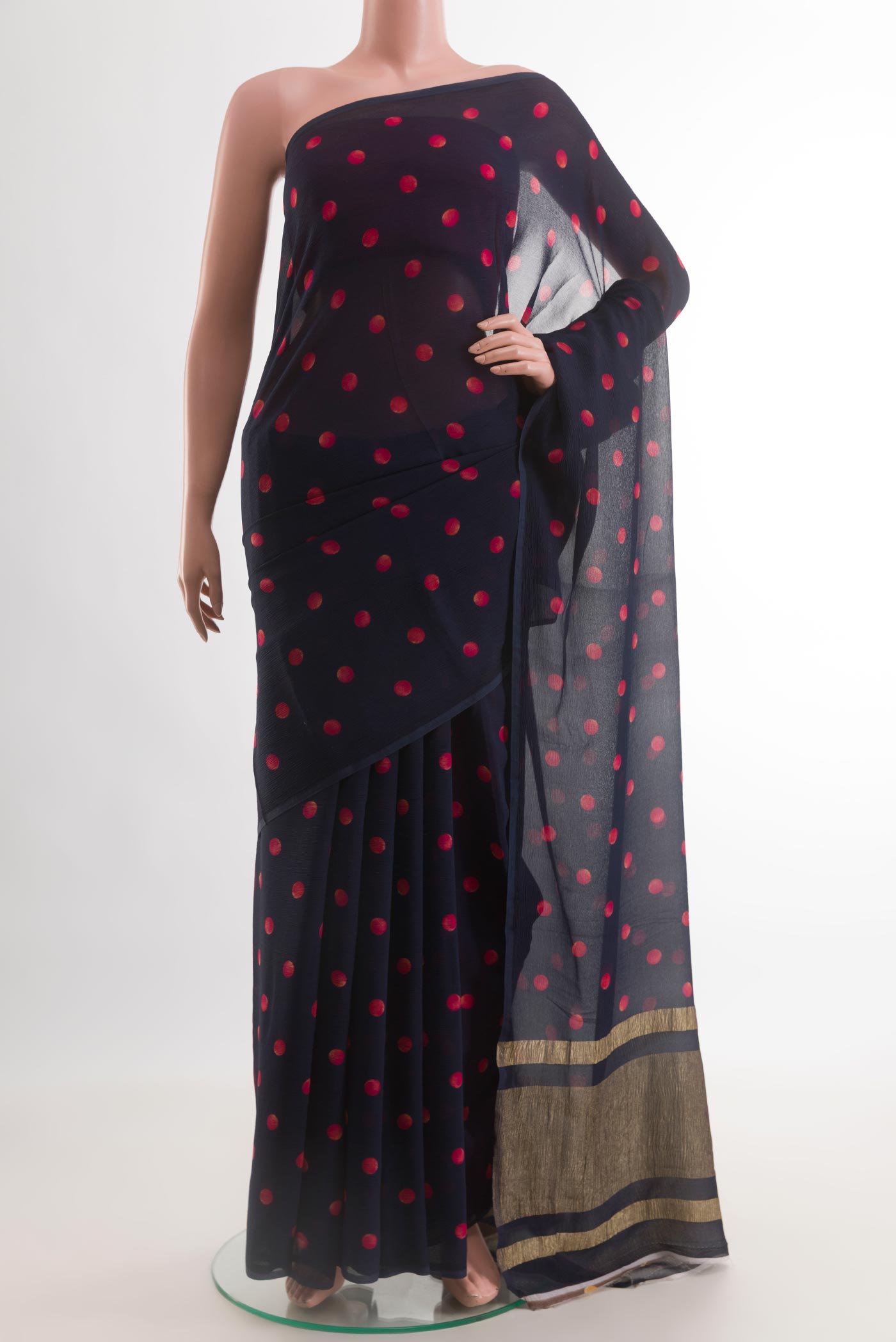 Navy Blue Mysore Chiffon Saree with Printed design on the body and Zari Border.  displayed on a mannequin