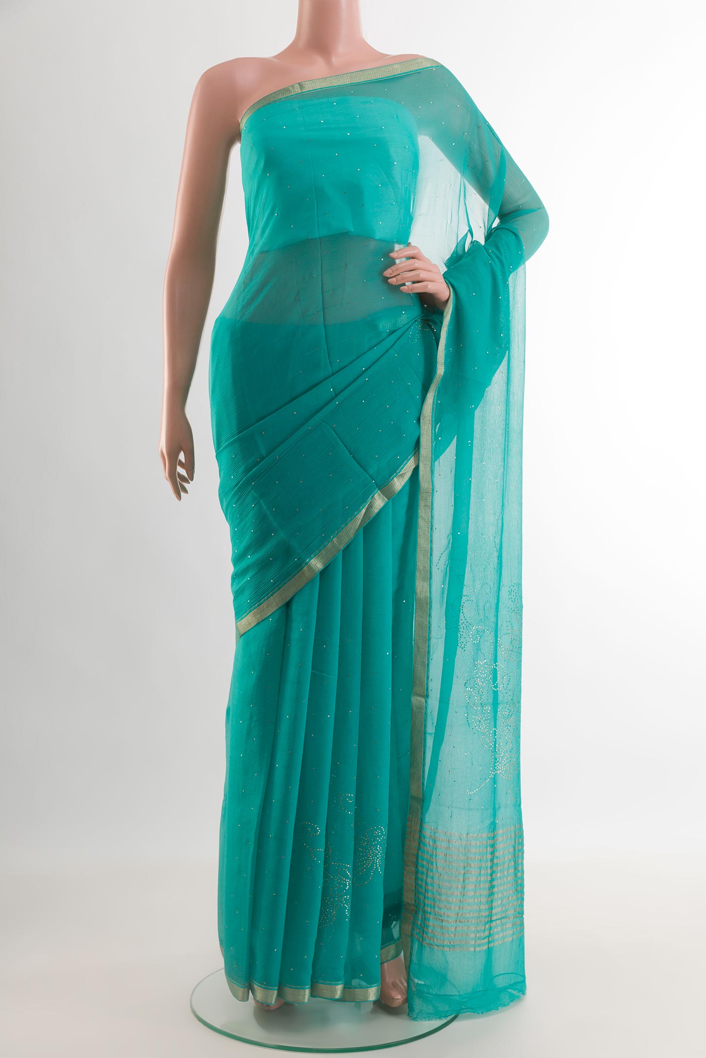 Turquoise Mysore Chiffon Saree with Embroidery on the body and Zari Border.  displayed on a mannequin