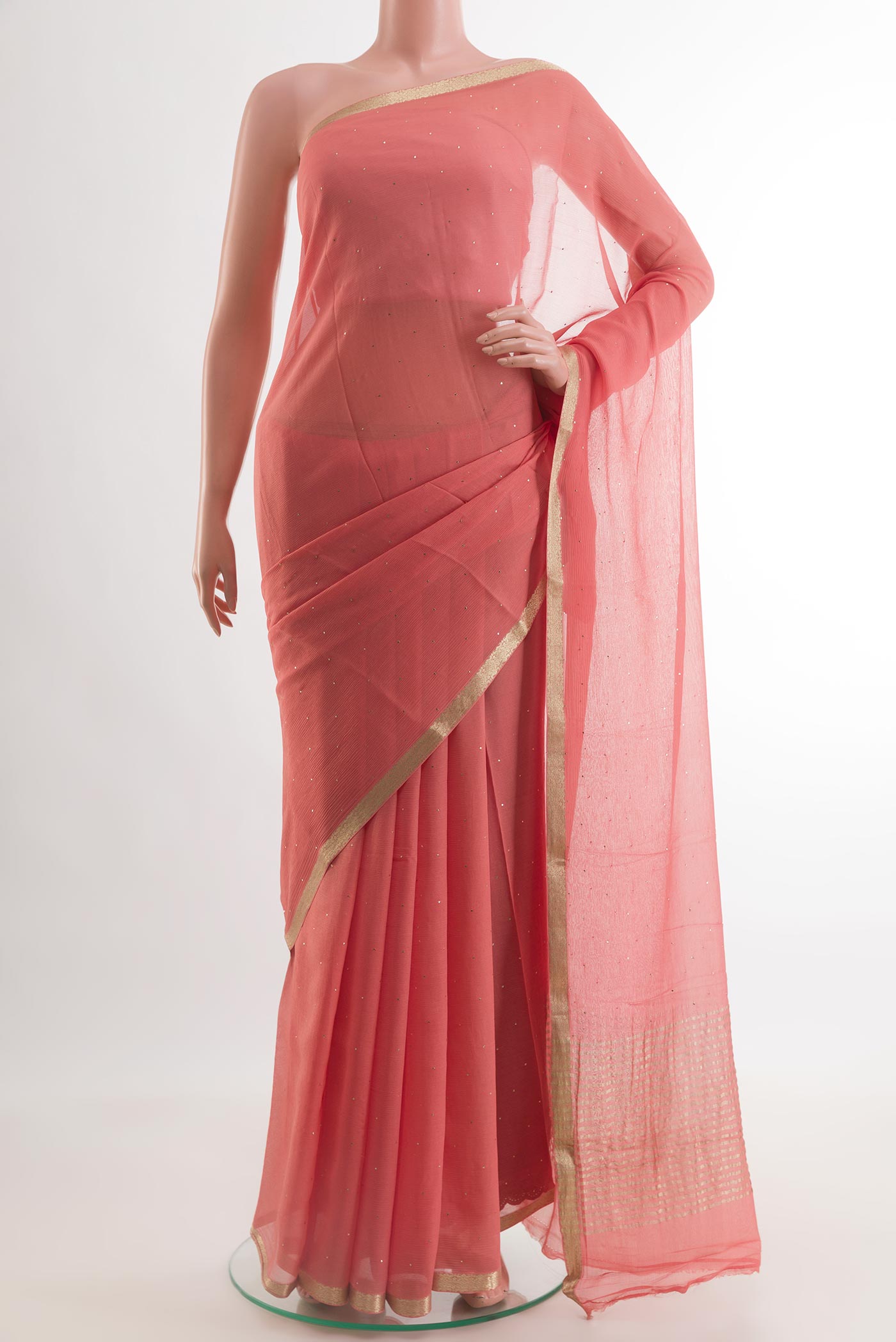 Coral Mysore Chiffon Saree with Embroidery on the body and Zari Border.  displayed on a mannequin