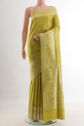 Lemon Yellow Banarasi Tussar Silk Saree with Zari Butta on the body and Zari Border.  displayed on a mannequin
