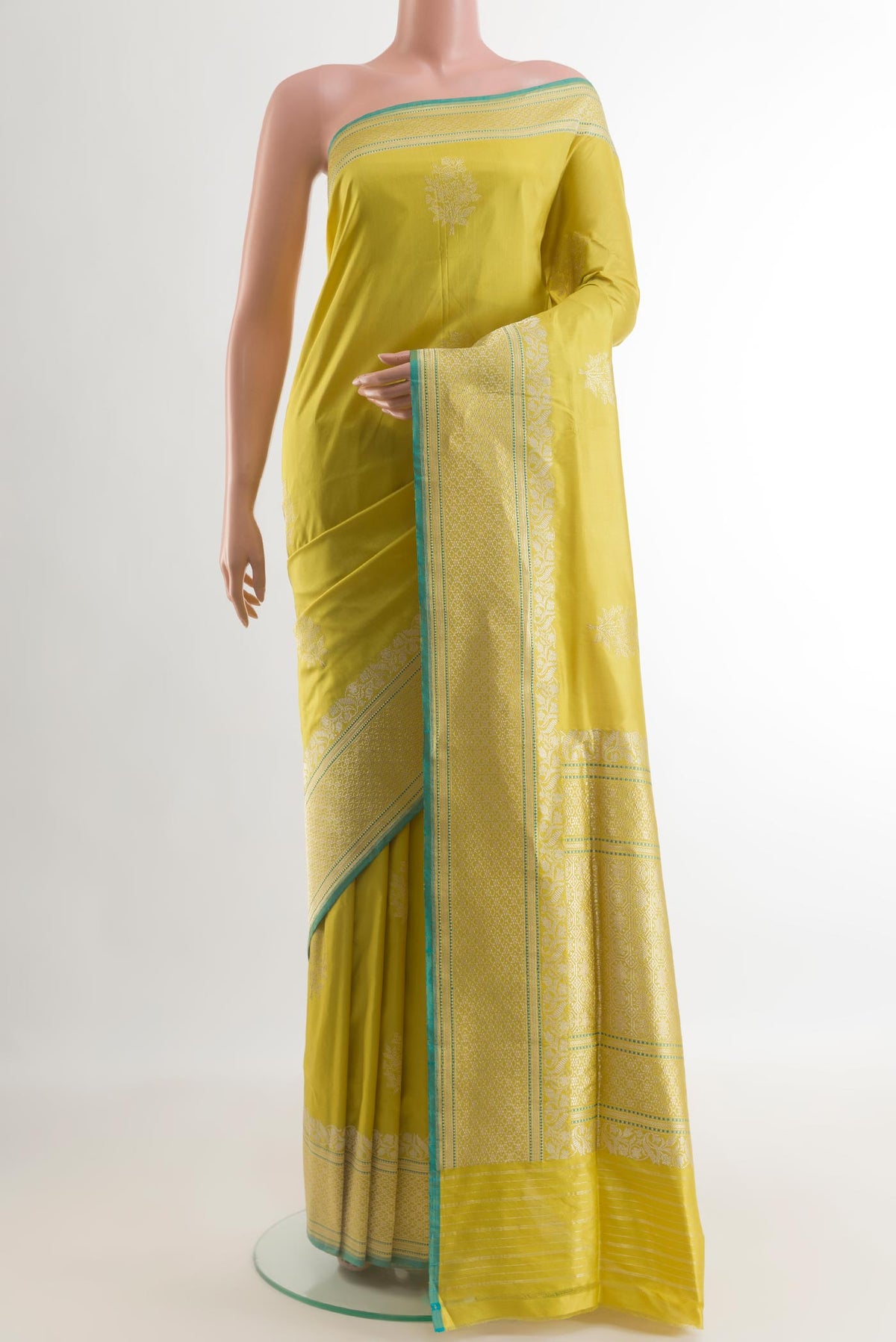 Yellow Banarasi Silk Saree with Zari Butta on the body and Zari Border.  displayed on a mannequin