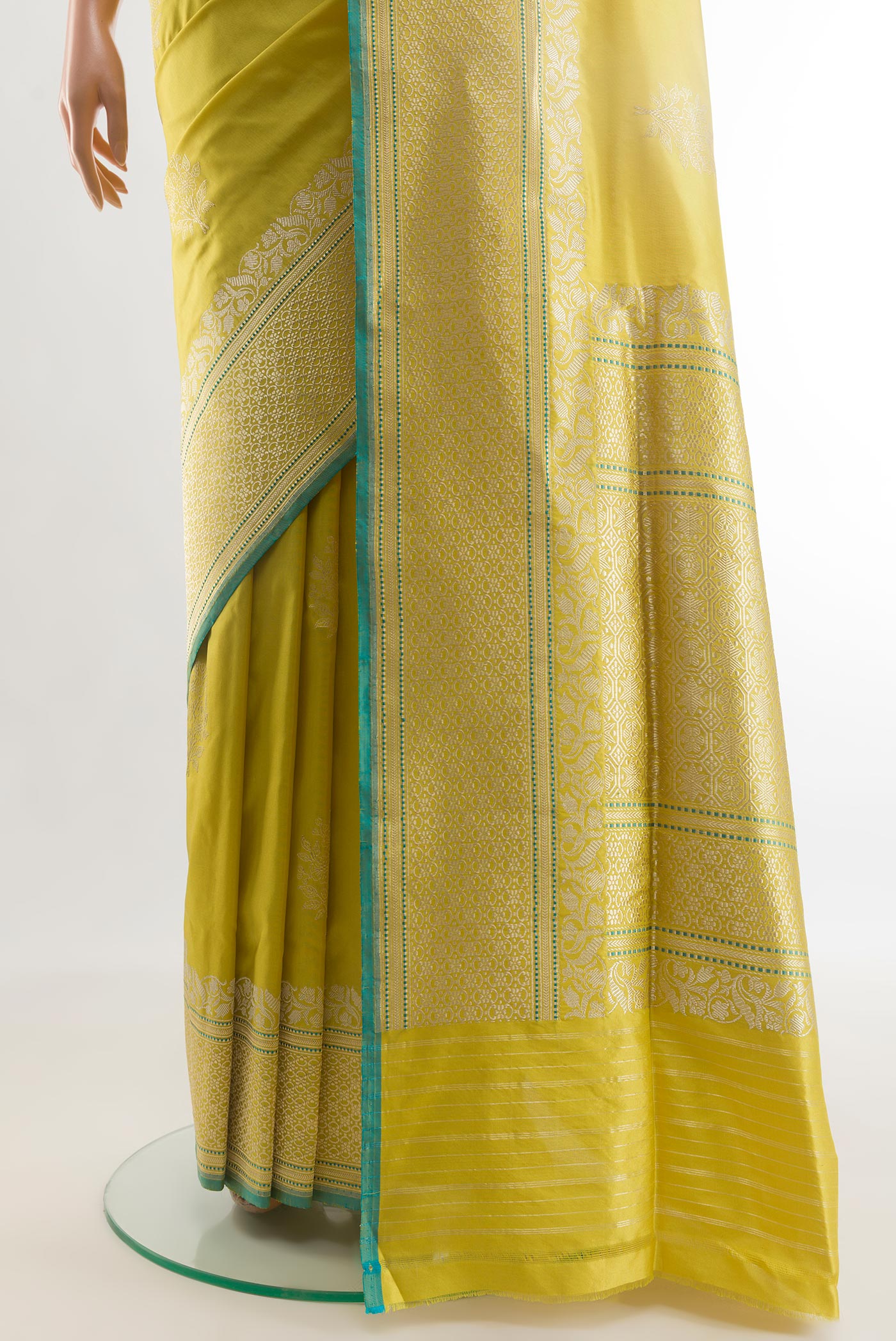 Pleats and pallu of Yellow Banarasi Silk Saree with Zari Butta on the body and Zari Border. 