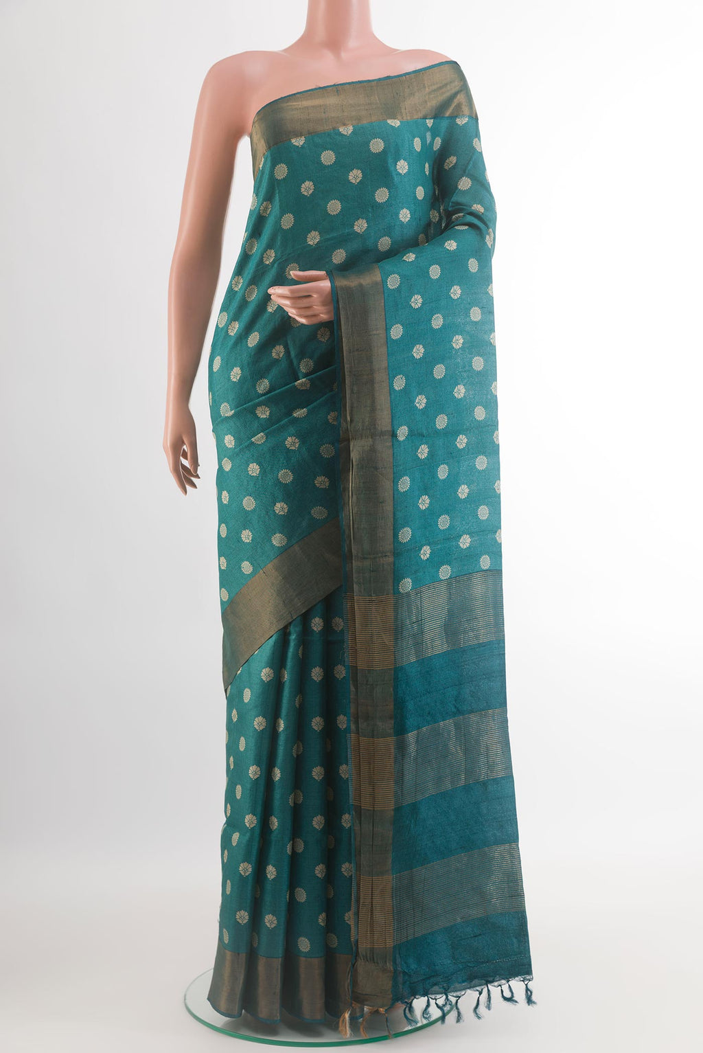 Blue Tussar Silk Saree with Printed design on the body and Zari Border.  displayed on a mannequin