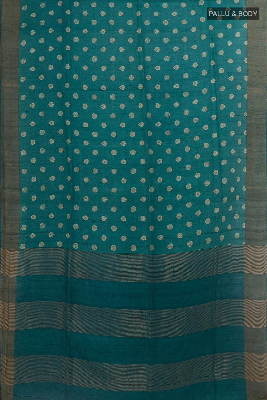 Flat view of Blue Tussar Silk Saree with Printed design on the body and Zari Border. 