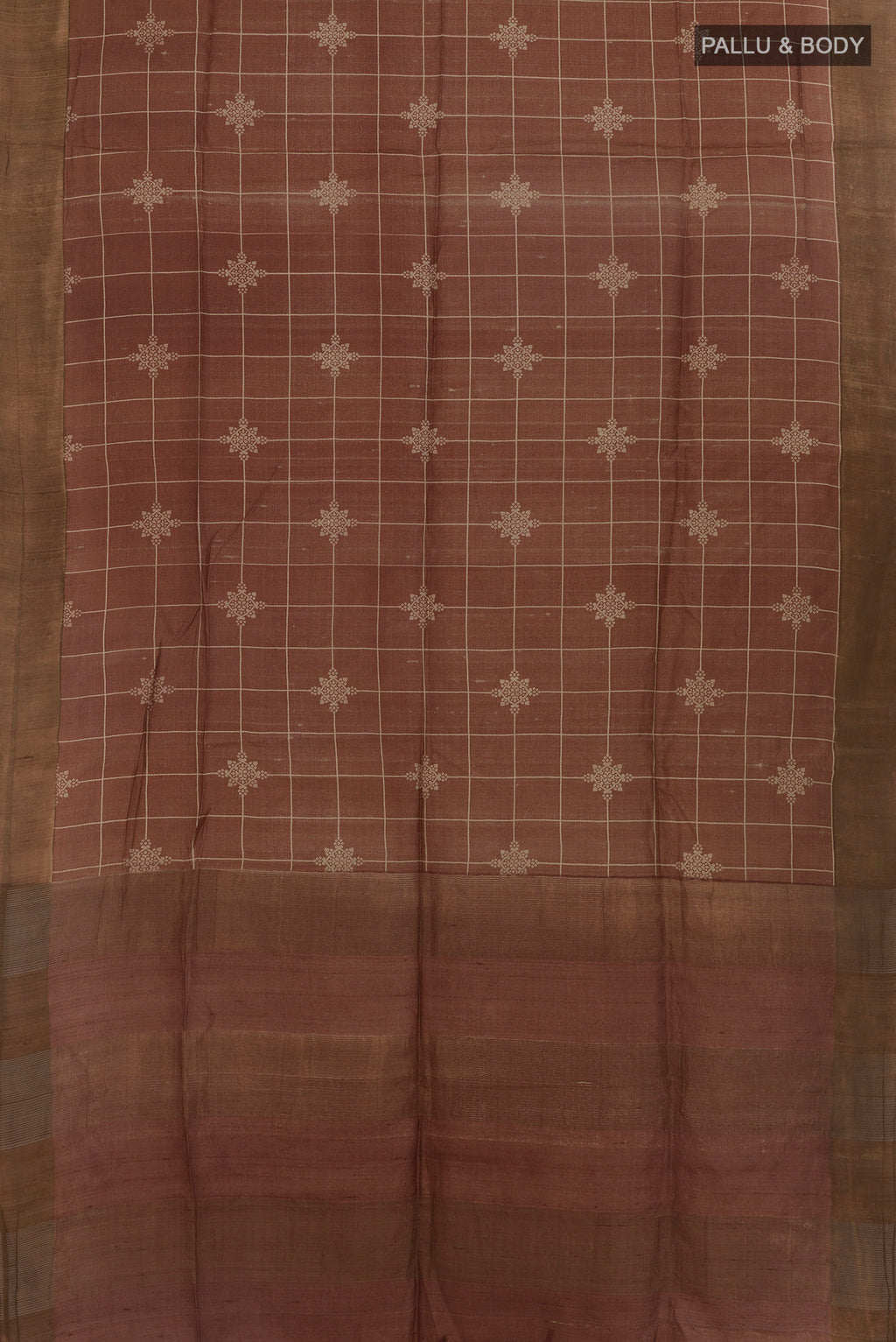 Flat view of Brown Tussar Saree with Checked design on the body and Zari Border. 