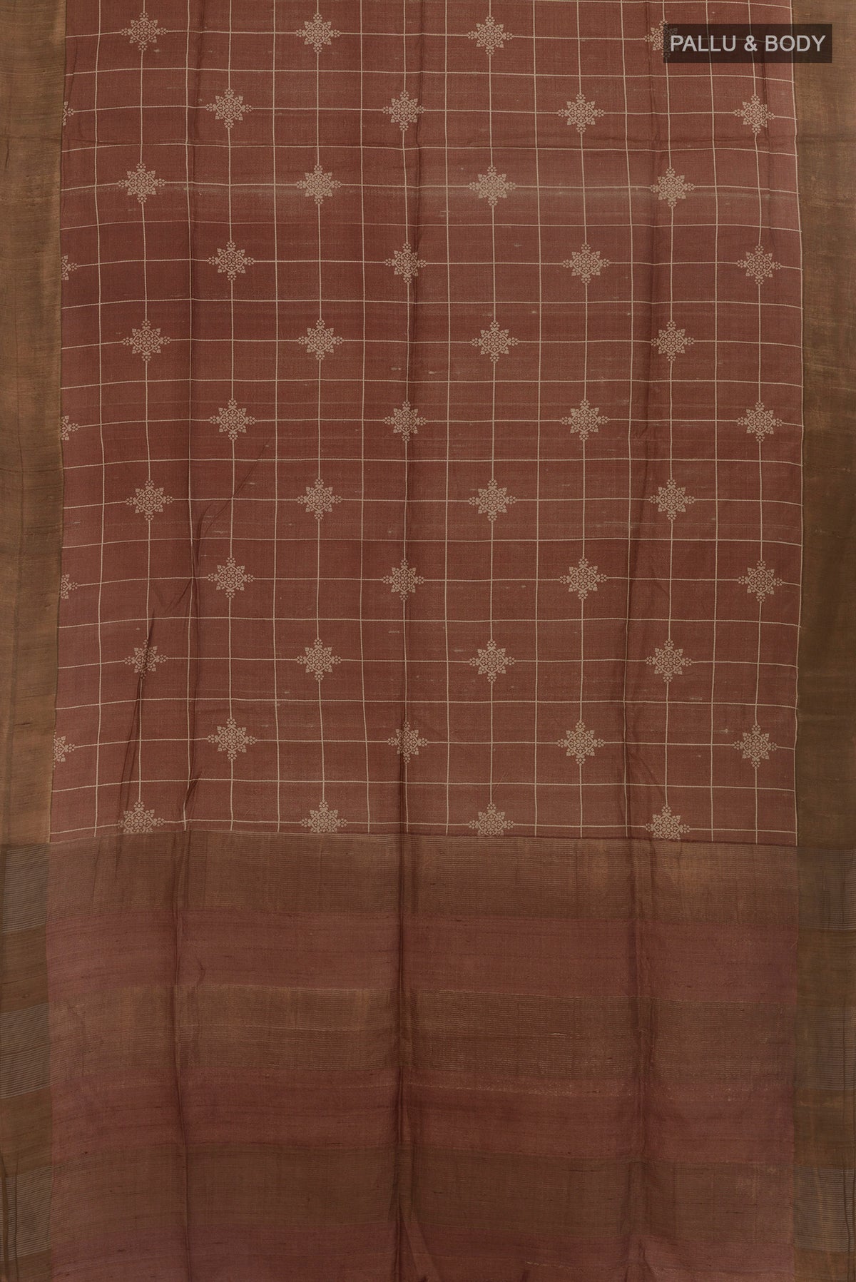 Flat view of Brown Tussar Saree with Checked design on the body and Zari Border. 