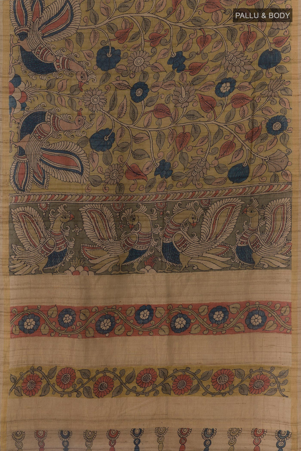 Flat view of Beige Tussar Silk Saree with kalamkari Print on the body and Zari Border. 