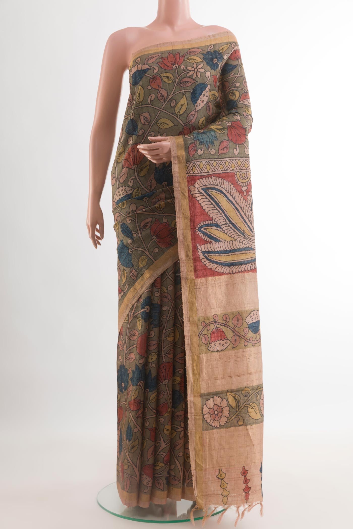 Mehandi Green Tussar Silk Saree with kalamkari Print on the body and Zari Border.  displayed on a mannequin