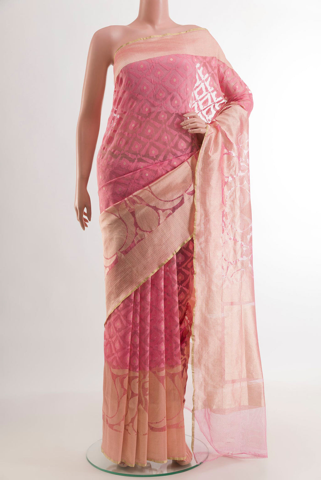 Rose pink Banarasi Kora Silk Saree with Jacquard design on the body and Zari Border.  displayed on a mannequin