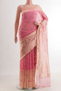 Rose pink Banarasi Kora Silk Saree with Jacquard design on the body and Zari Border.  displayed on a mannequin