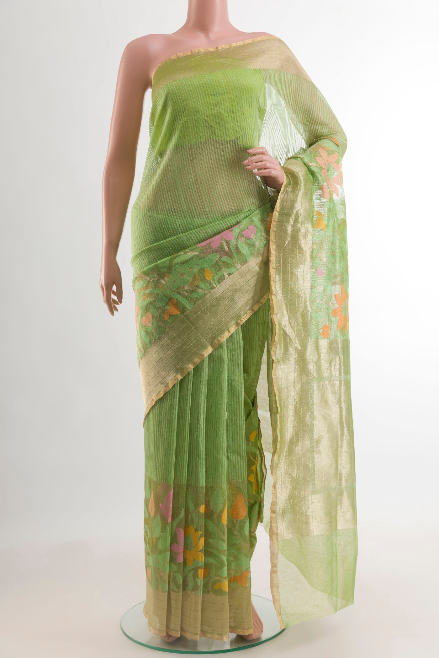 Pista Green Banarasi Kora Silk Saree with Plain Body and Zari Border.  displayed on a mannequin
