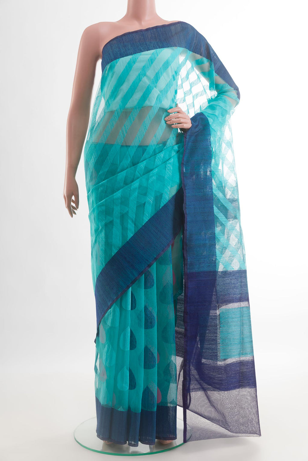 Light Blue Banarasi Kora Silk Saree with Thread Butta on the body and Plain Border.  displayed on a mannequin