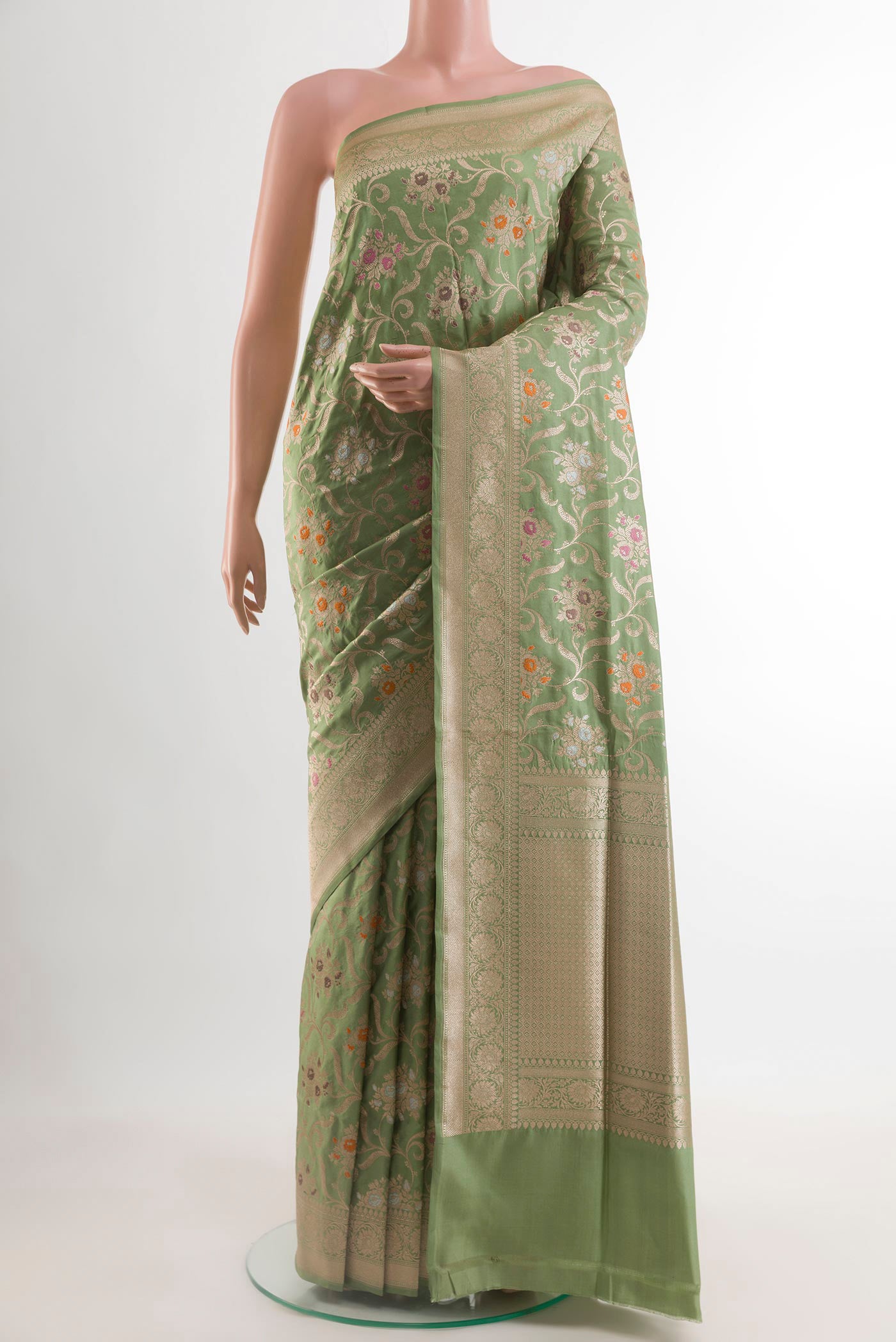 Sage Green Banarasi Silk Saree with Zari Brocade on the body and Zari Border.  displayed on a mannequin