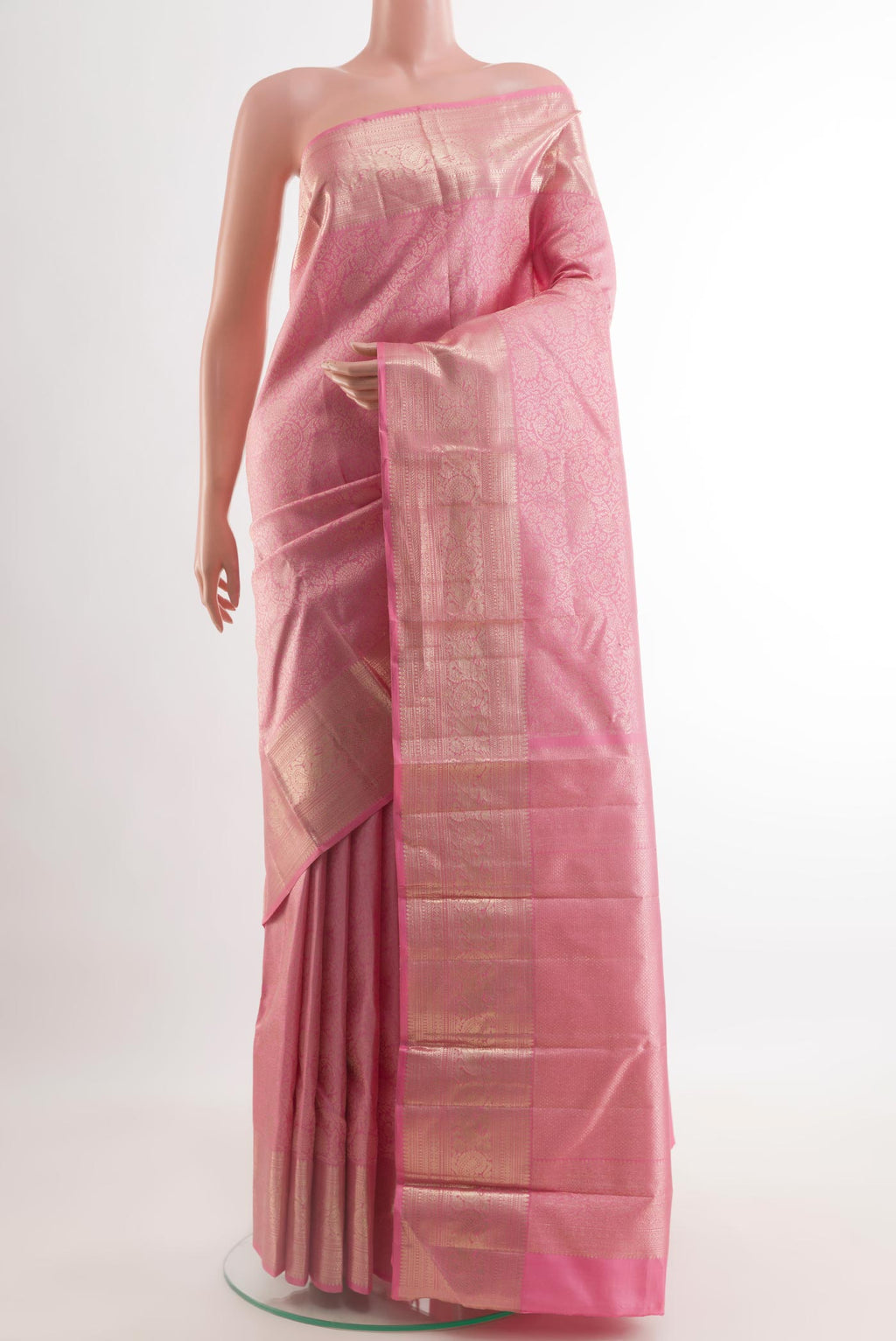 Pink Kanchipuram Silk Saree with Zari Brocade on the body and Zari Border.  displayed on a mannequin
