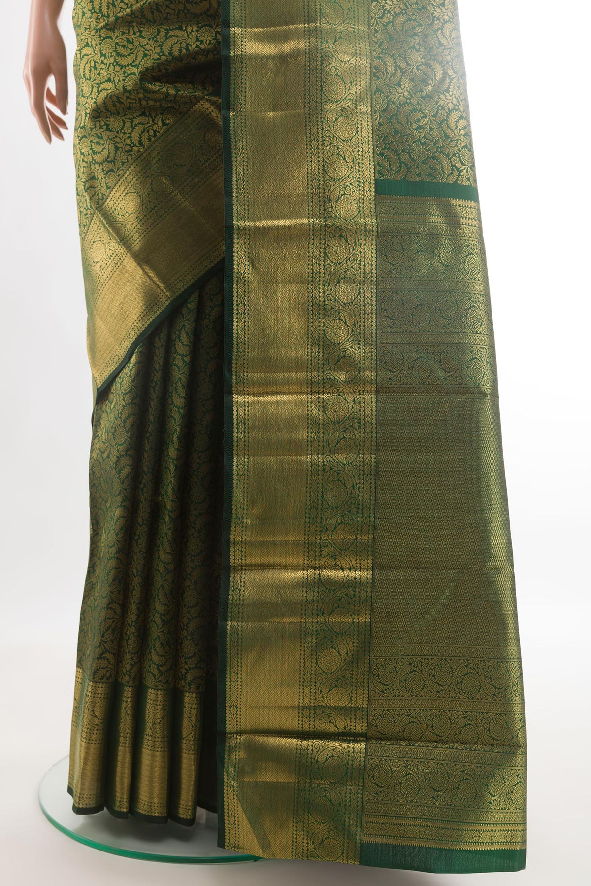 Pleats and pallu of Bottle Green Kanchipuram Silk Saree with Zari Brocade on the body and Zari Border. 