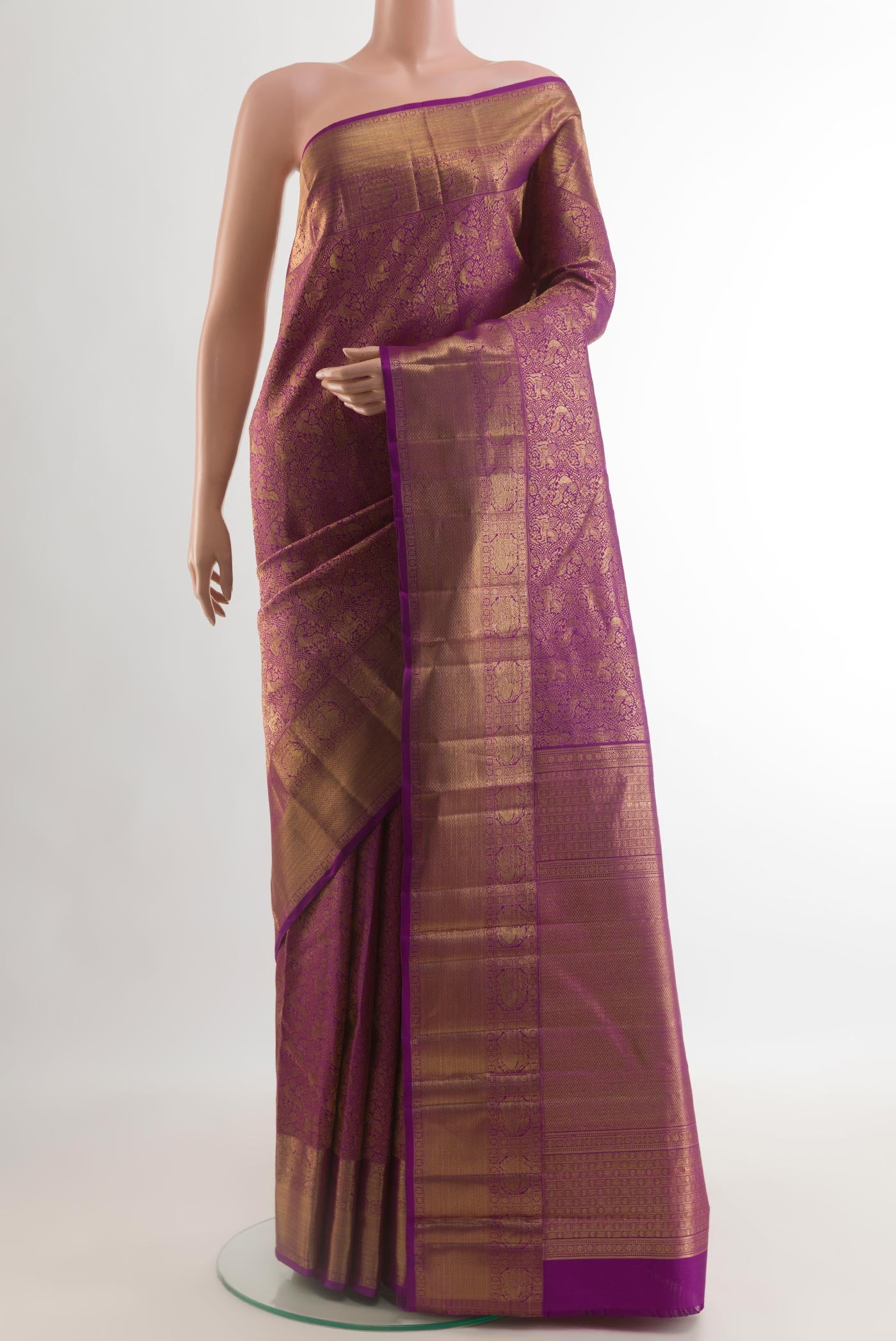 Purple Kanchipuram Silk Saree with Zari Brocade on the body and Zari Border.  displayed on a mannequin