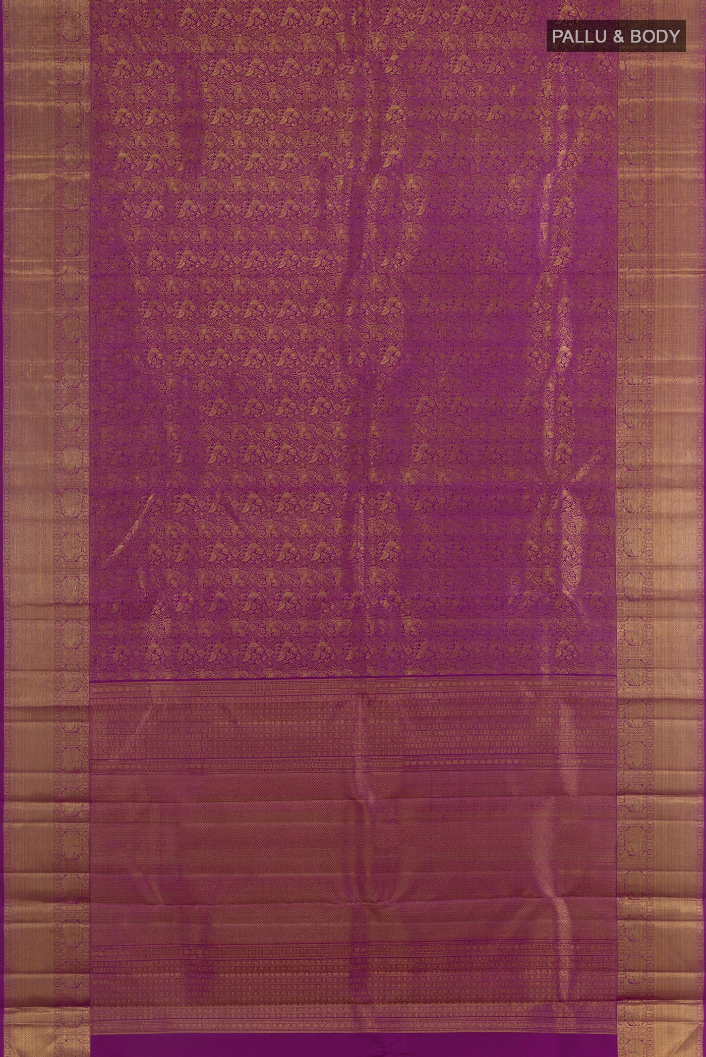 Flat view of Purple Kanchipuram Silk Saree with Zari Brocade on the body and Zari Border. 