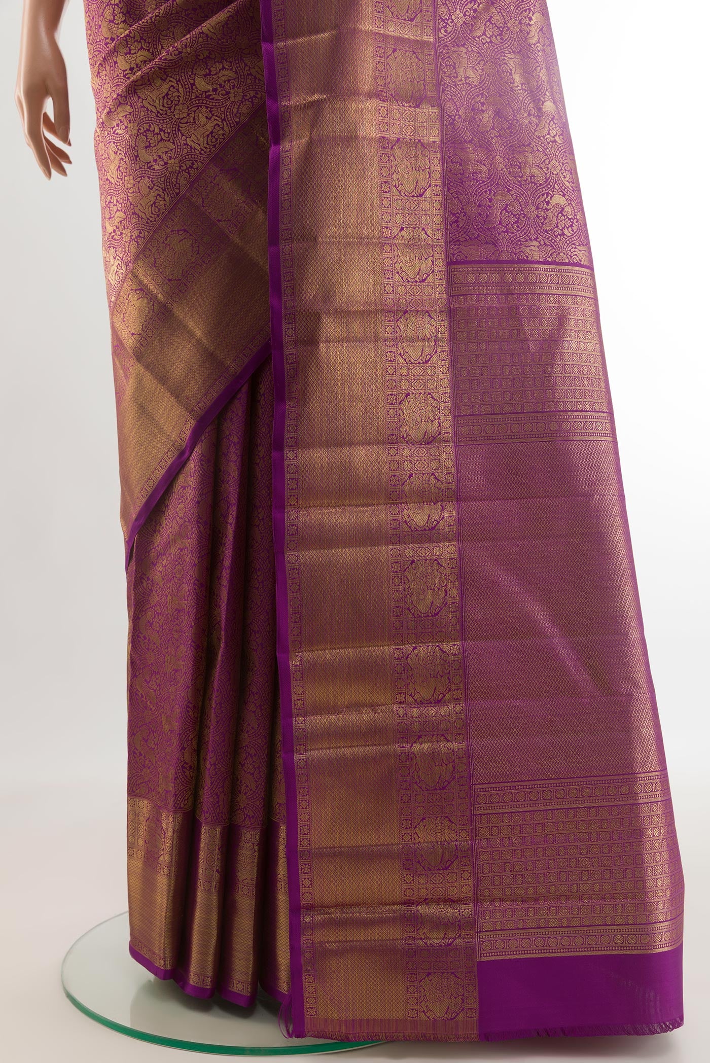 Pleats and pallu of Purple Kanchipuram Silk Saree with Zari Brocade on the body and Zari Border. 