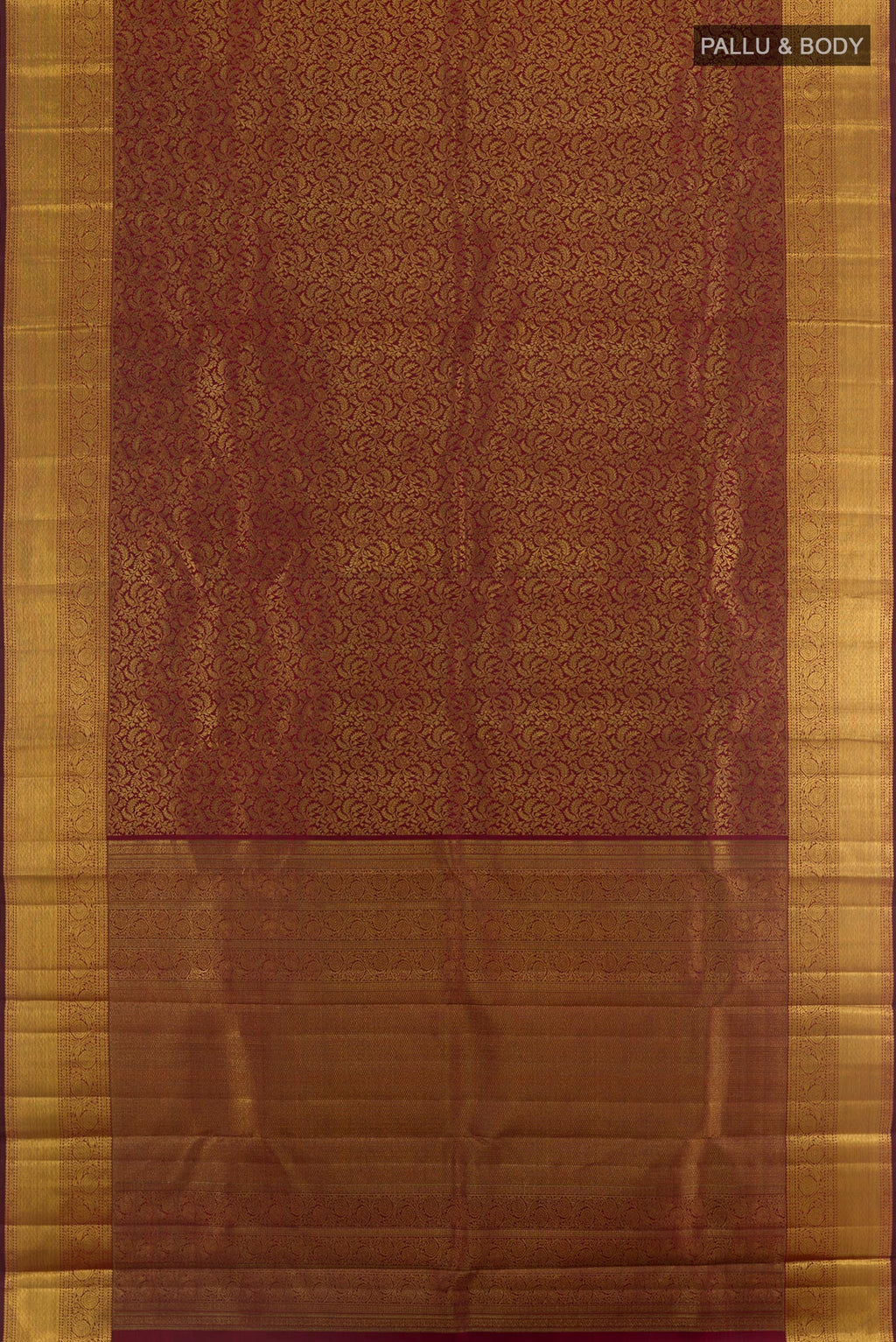 Flat view of Maroon Kanchipuram Silk Saree with Zari Brocade on the body and Zari Border. 