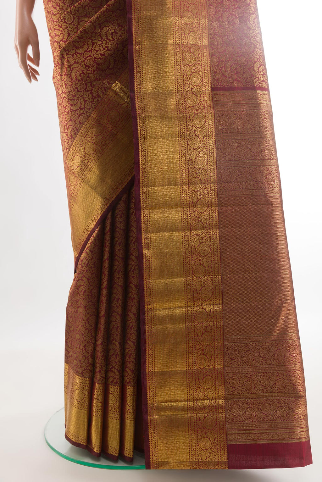 Pleats and pallu of Maroon Kanchipuram Silk Saree with Zari Brocade on the body and Zari Border. 