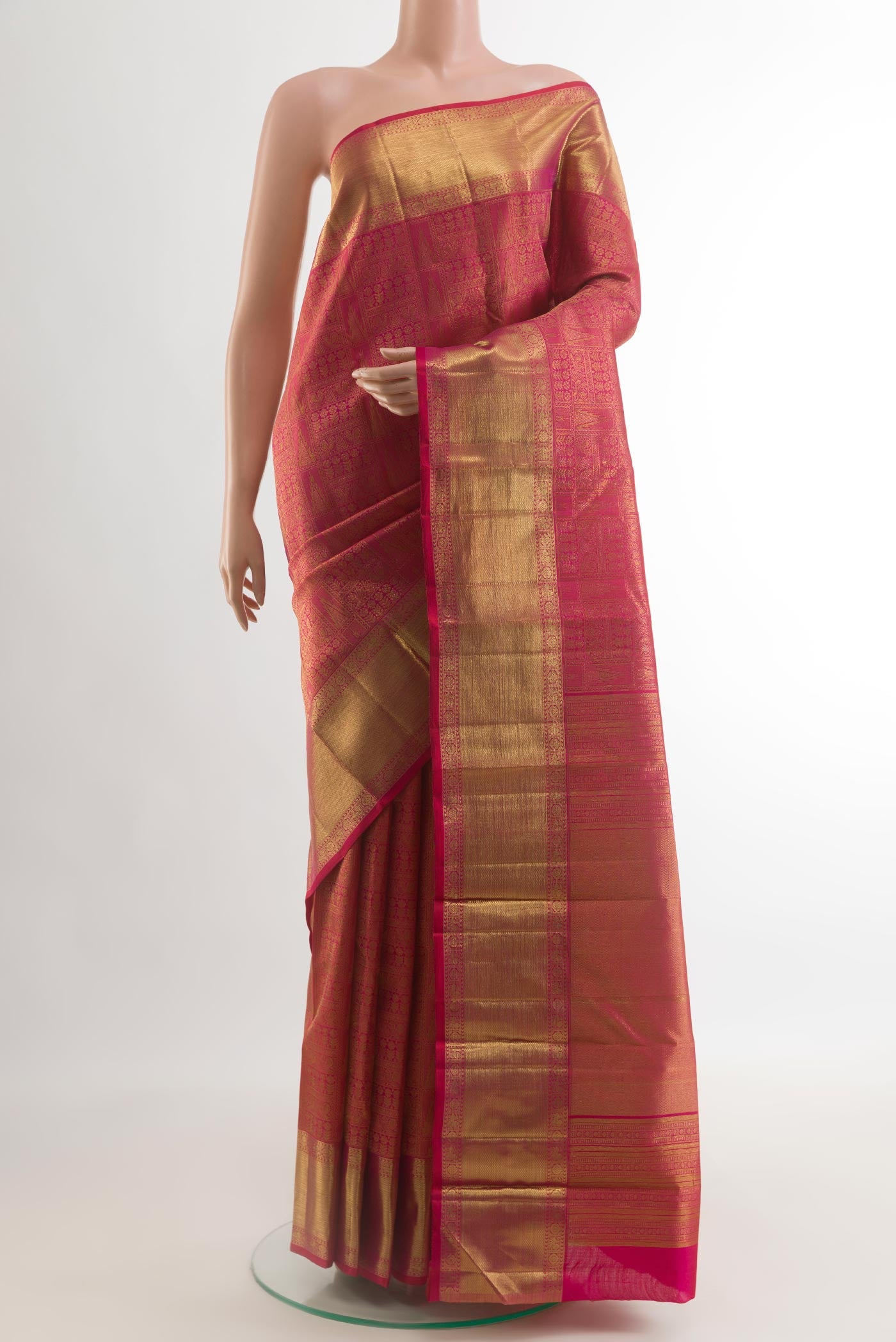 Dark Pink Kanchipuram Silk Saree with Zari Brocade on the body and Zari Border.  displayed on a mannequin