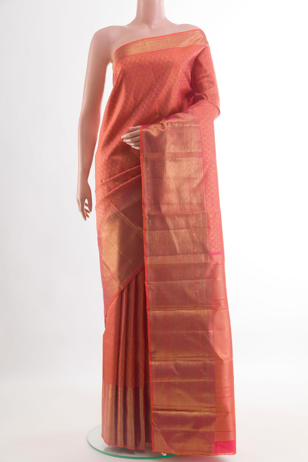 Coral Kanchipuram Silk Saree with Zari Brocade on the body and Zari Border.  displayed on a mannequin