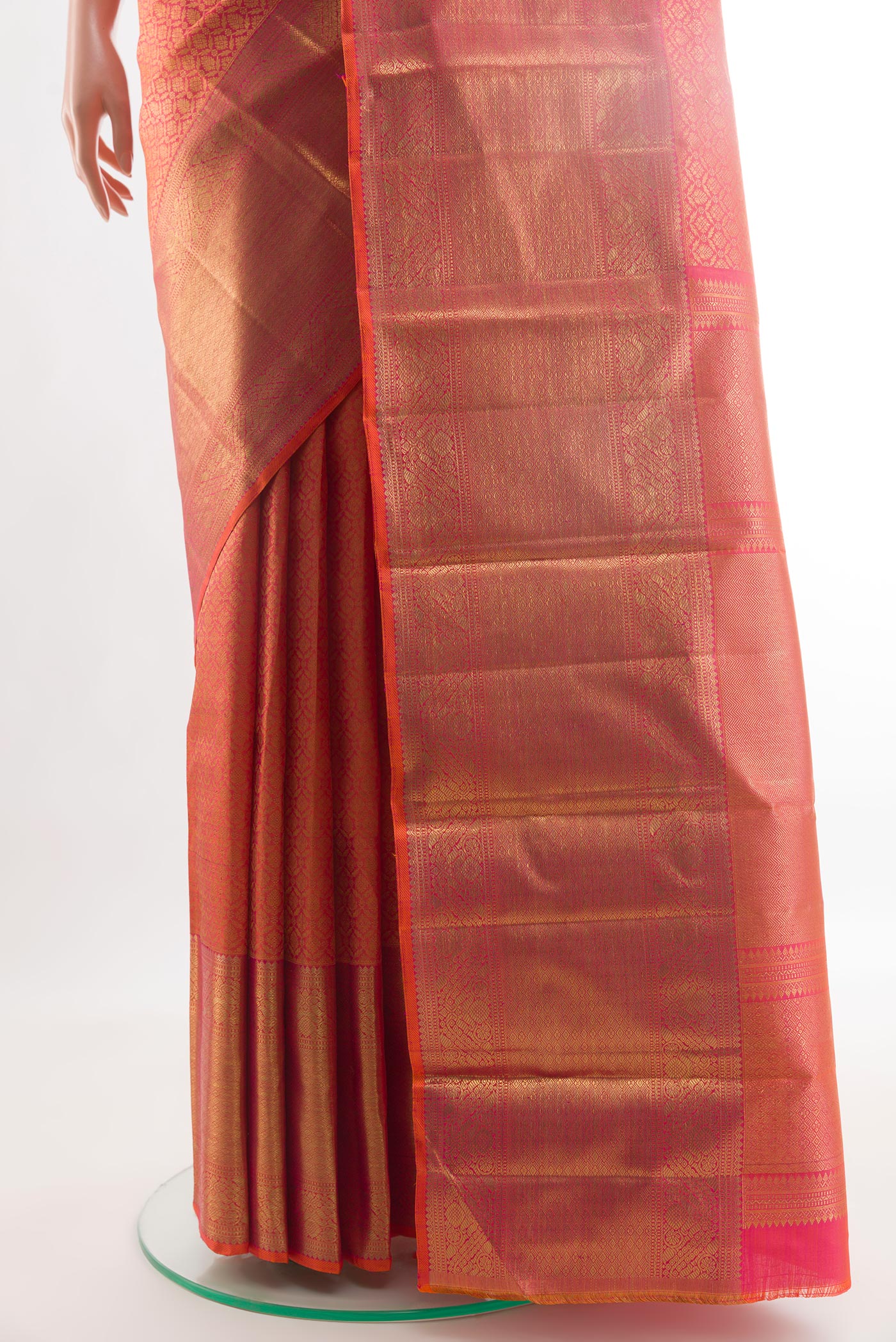 Pleats and pallu of Coral Kanchipuram Silk Saree with Zari Brocade on the body and Zari Border. 