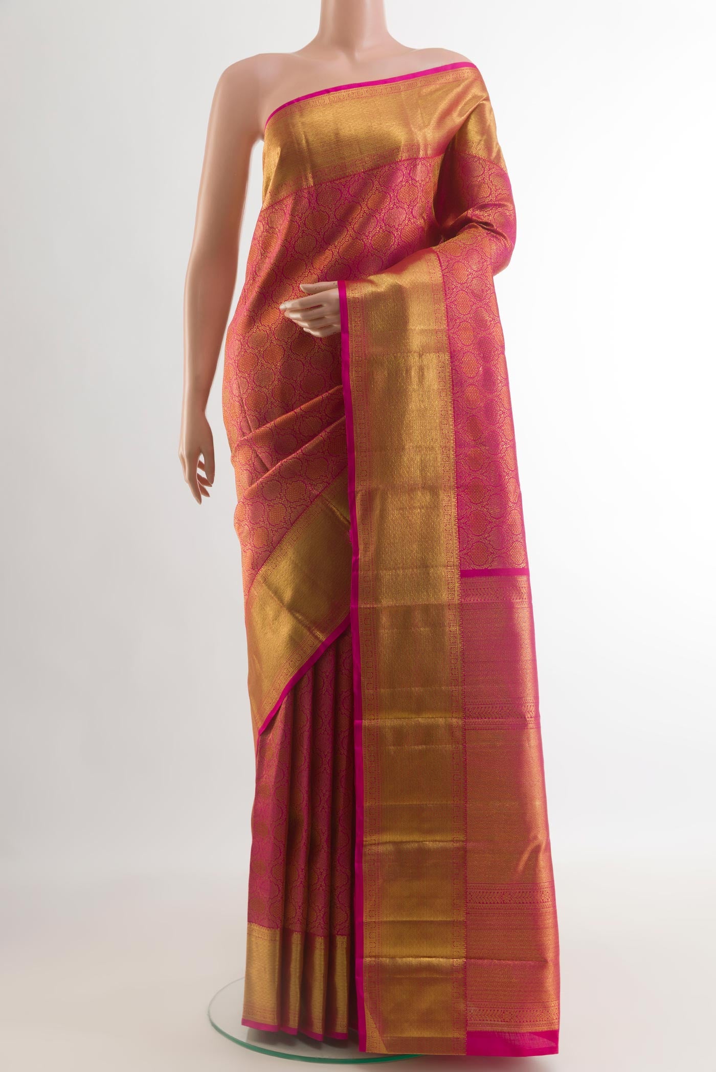Pink Kanchipuram Silk Saree with Zari Brocade on the body and Zari Border.  displayed on a mannequin