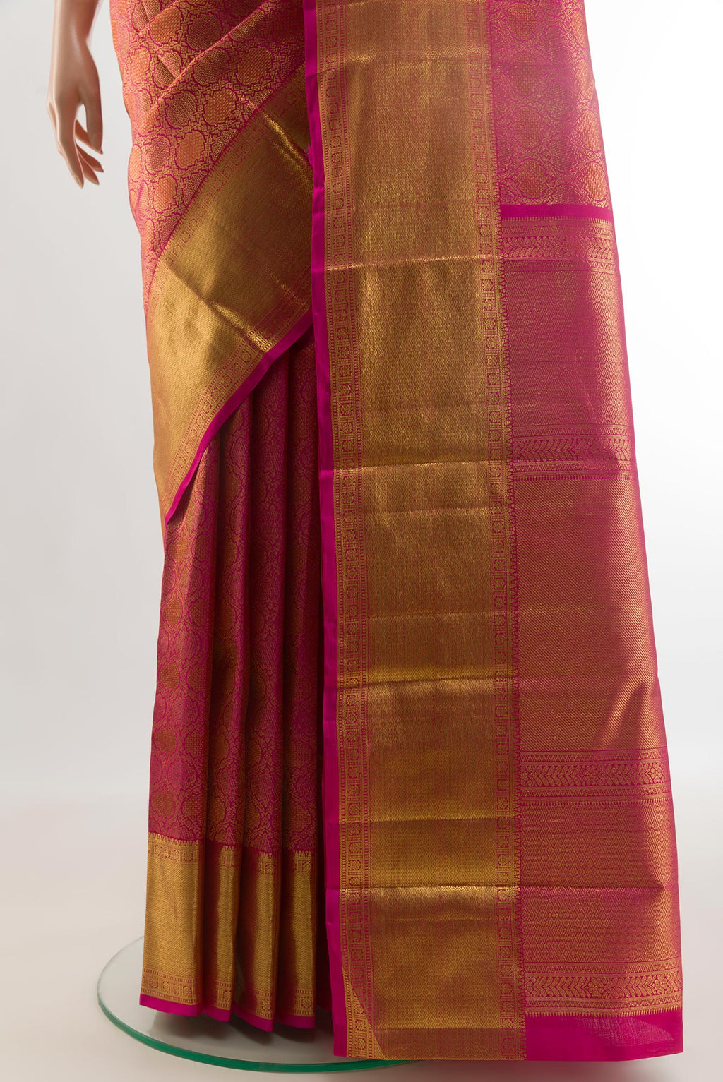 Pleats and pallu of Pink Kanchipuram Silk Saree with Zari Brocade on the body and Zari Border. 