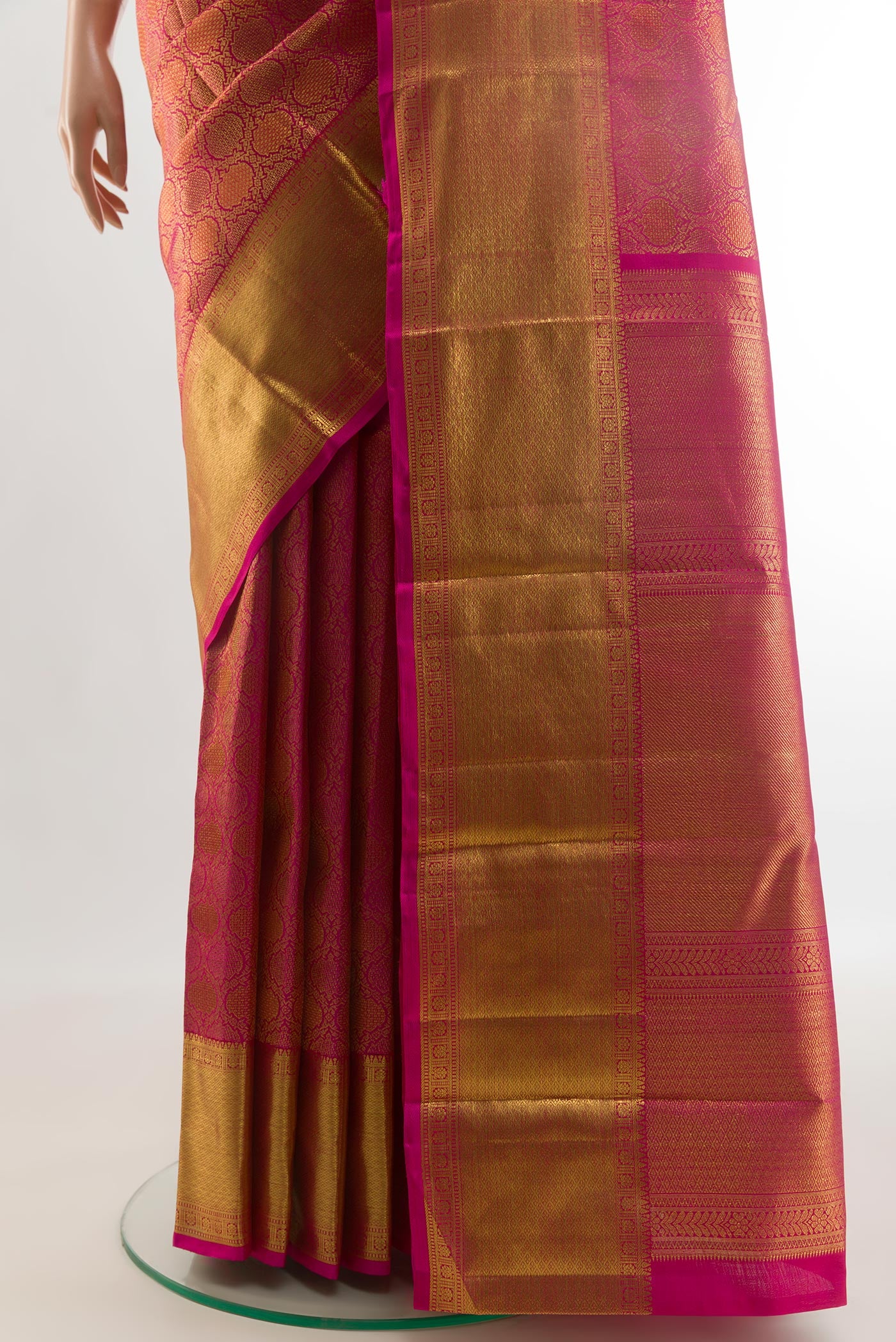 Pleats and pallu of Pink Kanchipuram Silk Saree with Zari Brocade on the body and Zari Border. 