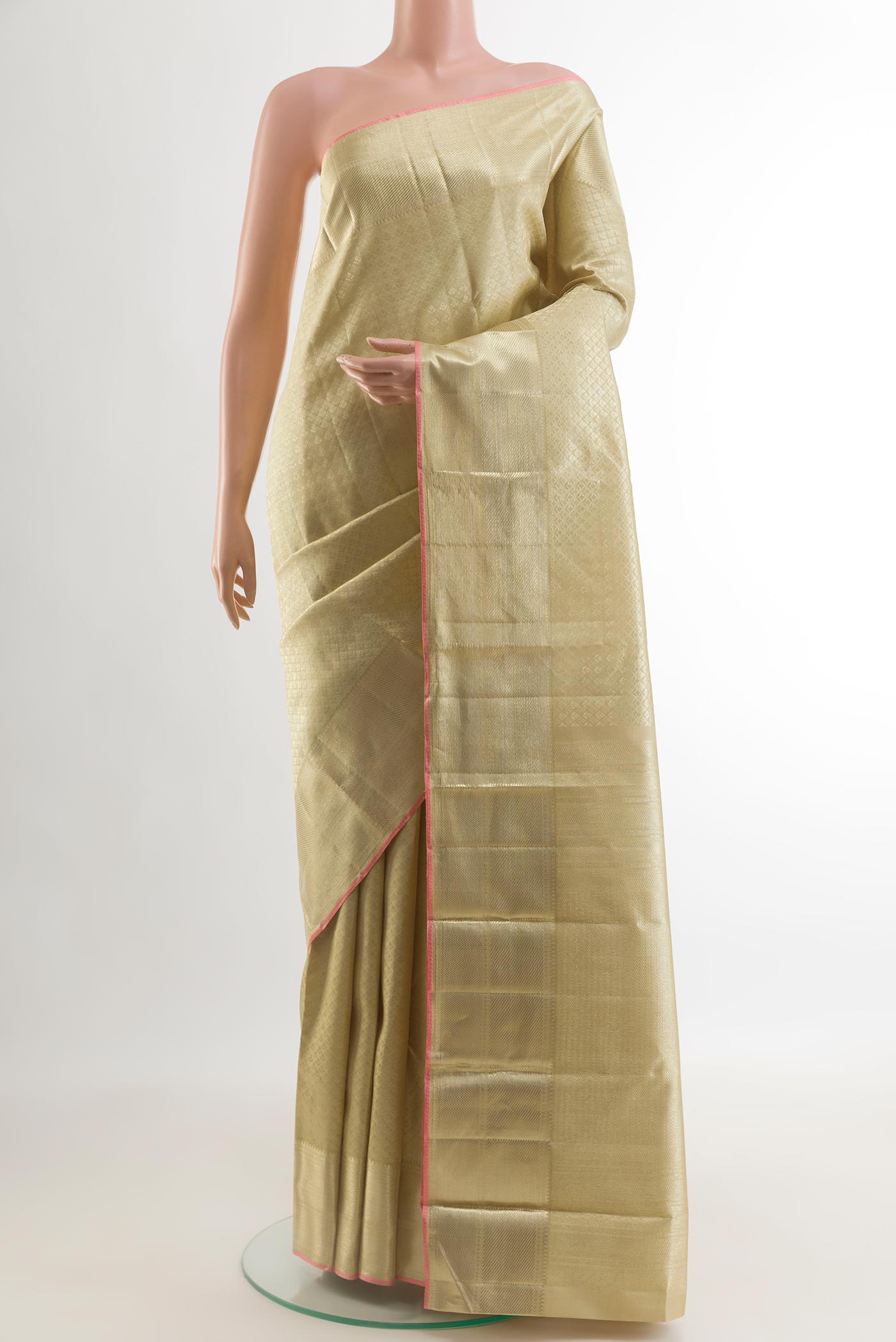 Beige Kanchipuram Silk Saree with Zari Brocade on the body and Zari Border.  displayed on a mannequin