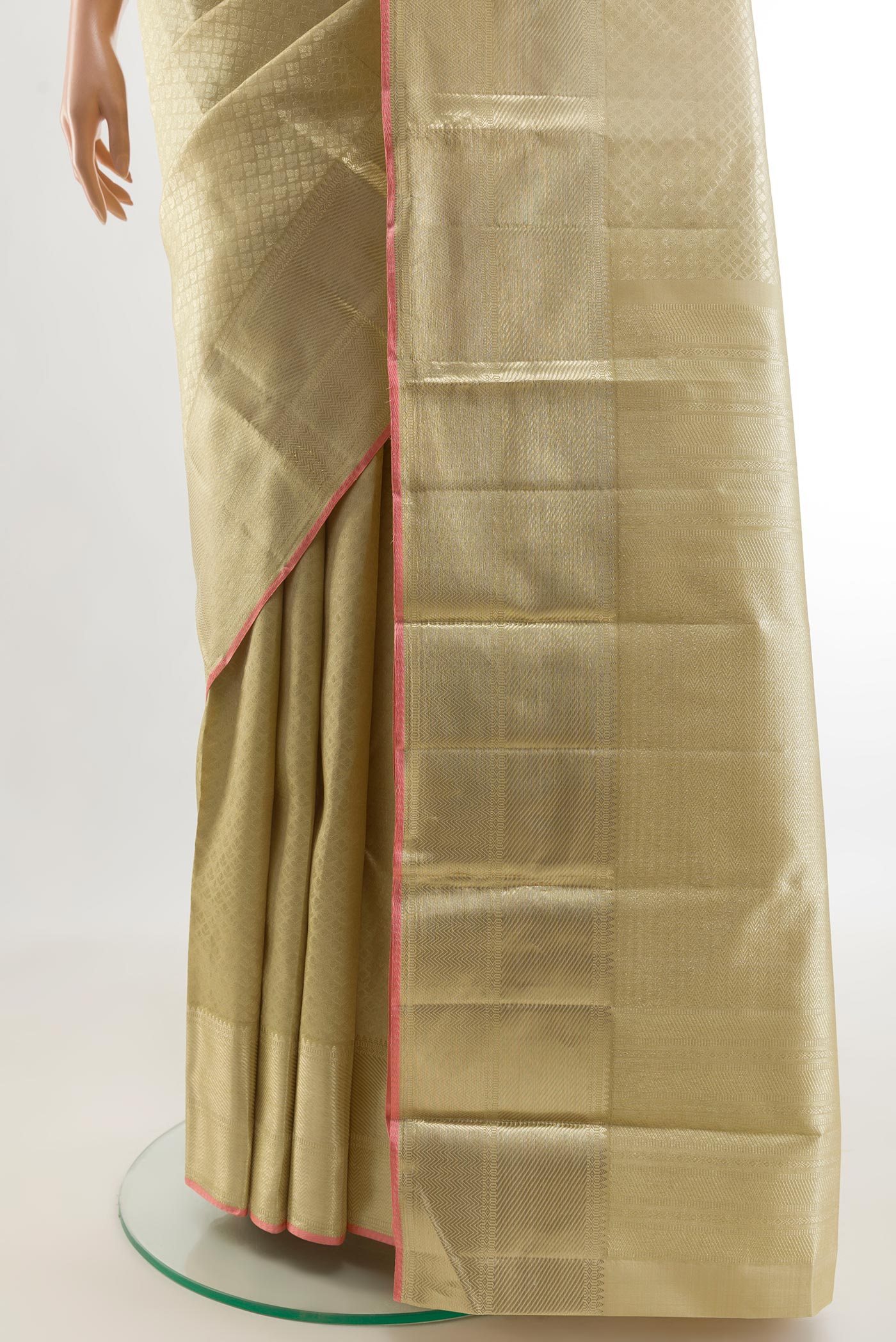 Pleats and pallu of Beige Kanchipuram Silk Saree with Zari Brocade on the body and Zari Border. 