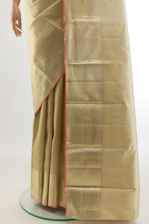 Pleats and pallu of Beige Kanchipuram Silk Saree with Zari Brocade on the body and Zari Border. 