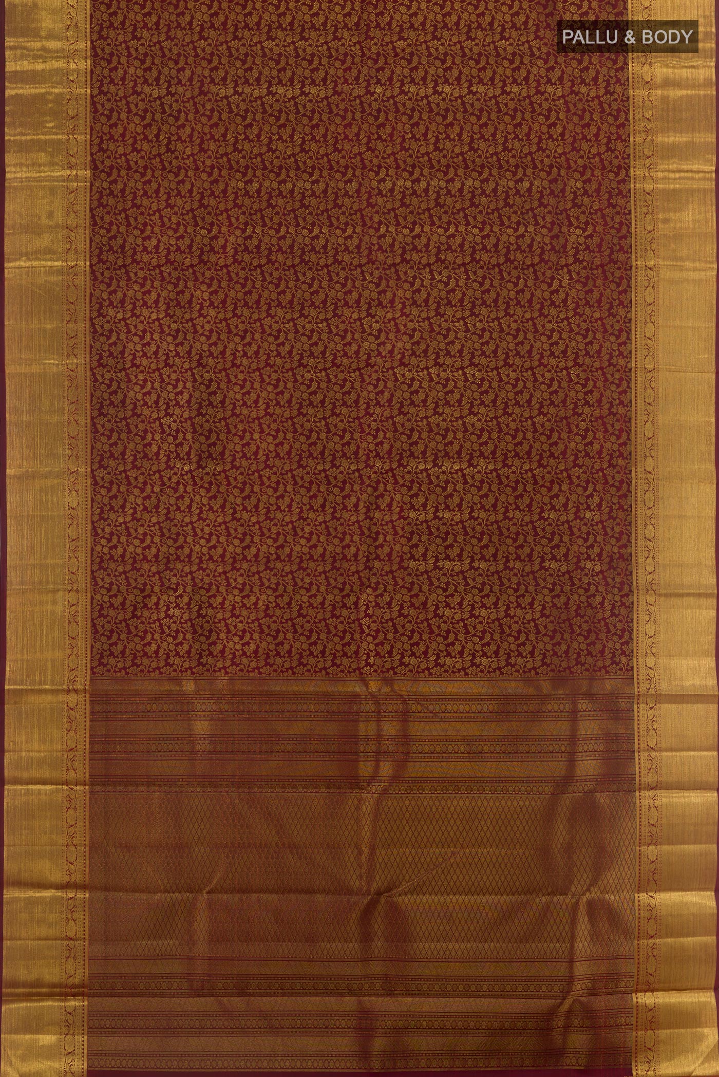 Flat view of Maroon Kanchipuram Silk Saree with Zari Brocade on the body and Zari Border. 