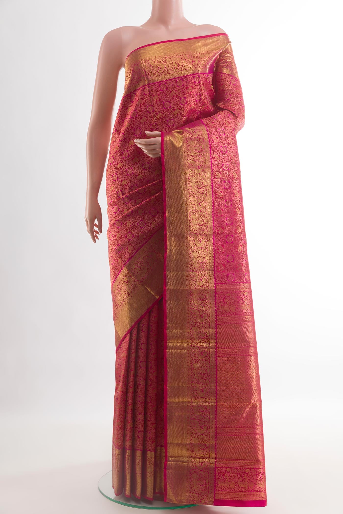 Pink Kanchipuram Silk Saree with Zari Brocade on the body and Zari Border.  displayed on a mannequin