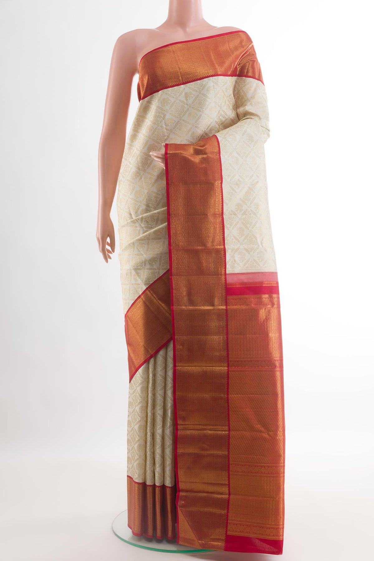 Off White Kanjivaram Silk Saree with Zari Brocade on the body and Zari Border.  displayed on a mannequin