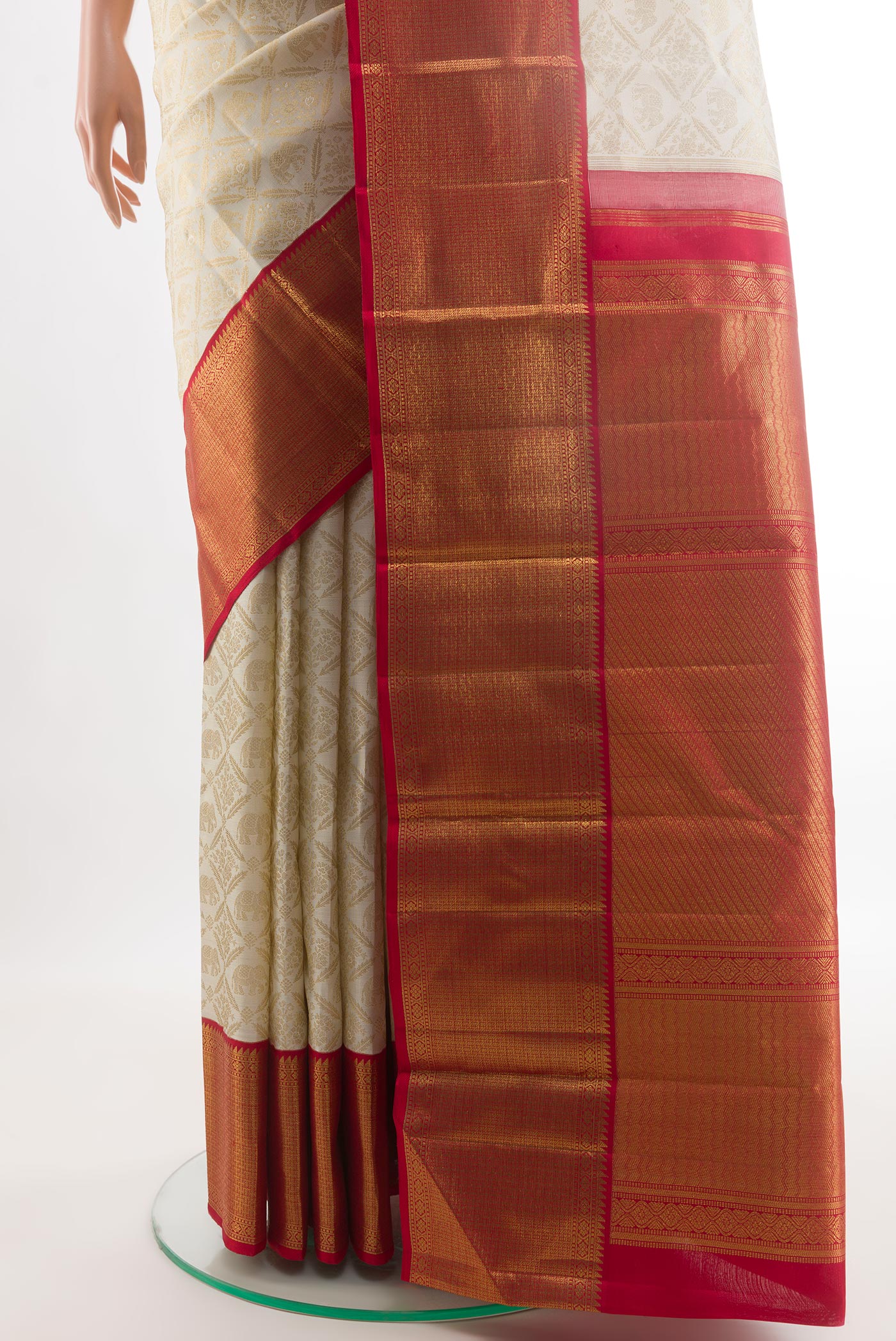 Pleats and pallu of Off White Kanjivaram Silk Saree with Zari Brocade on the body and Zari Border. 