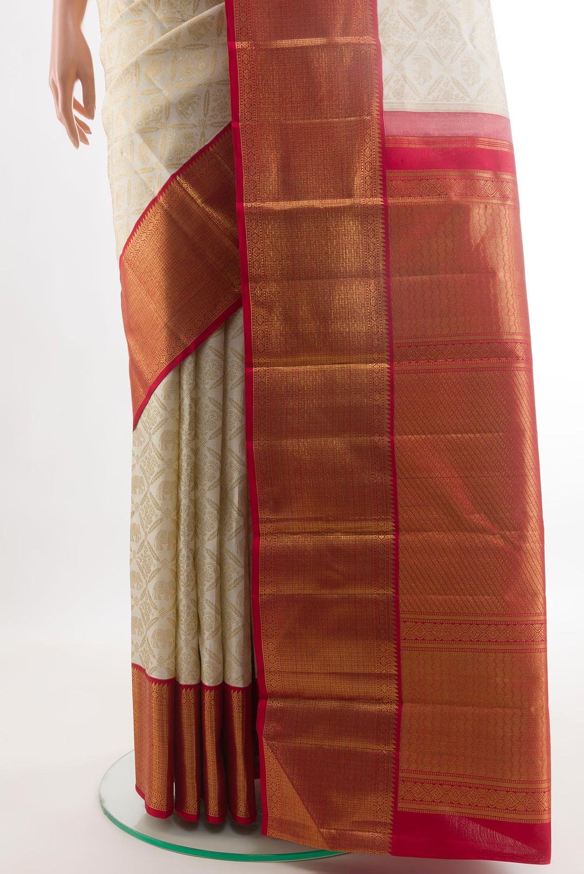 Pleats and pallu of Off White Kanjivaram Silk Saree with Zari Brocade on the body and Zari Border. 
